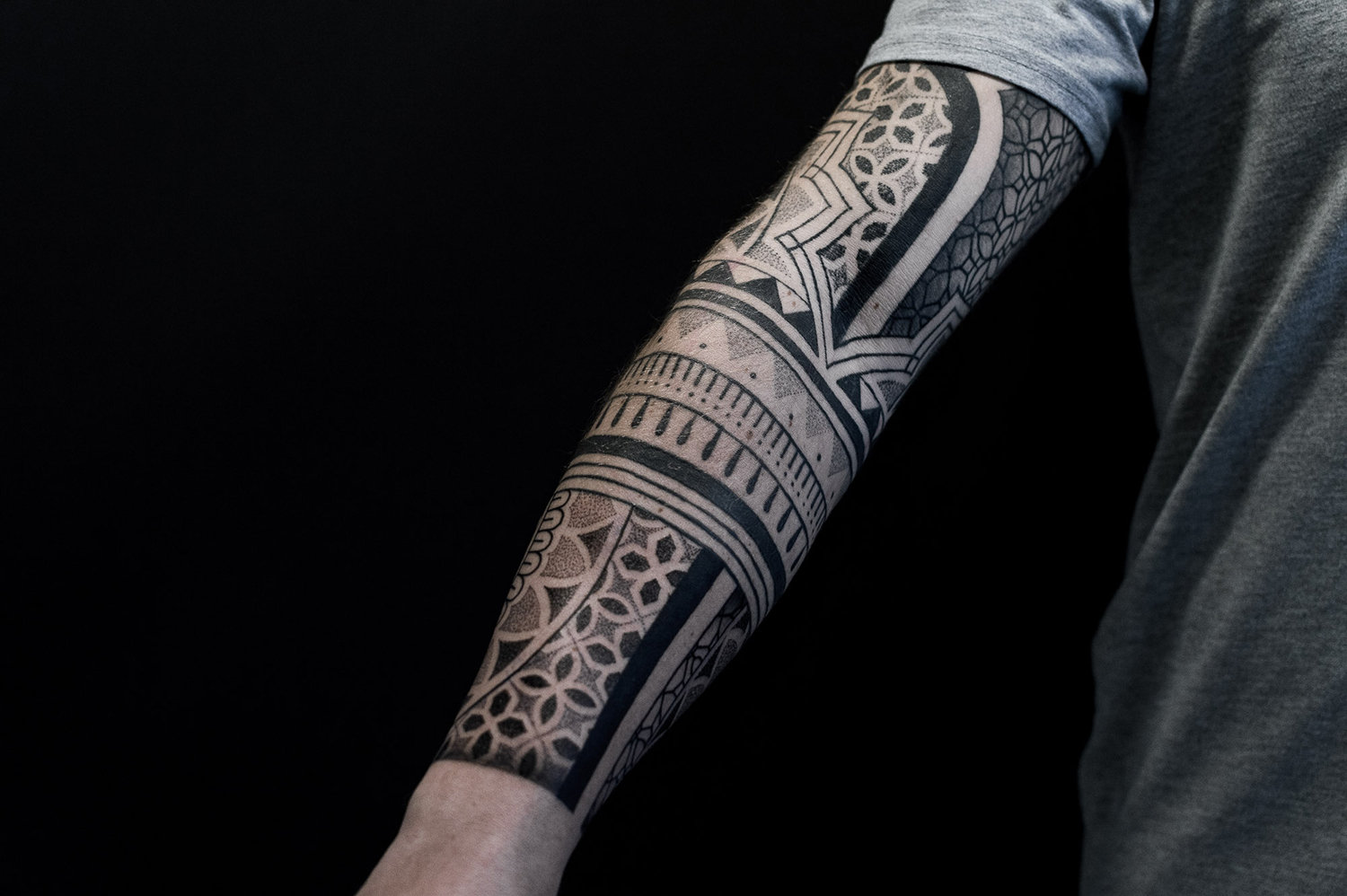 geometric arm tattoo by paradox, black ink
