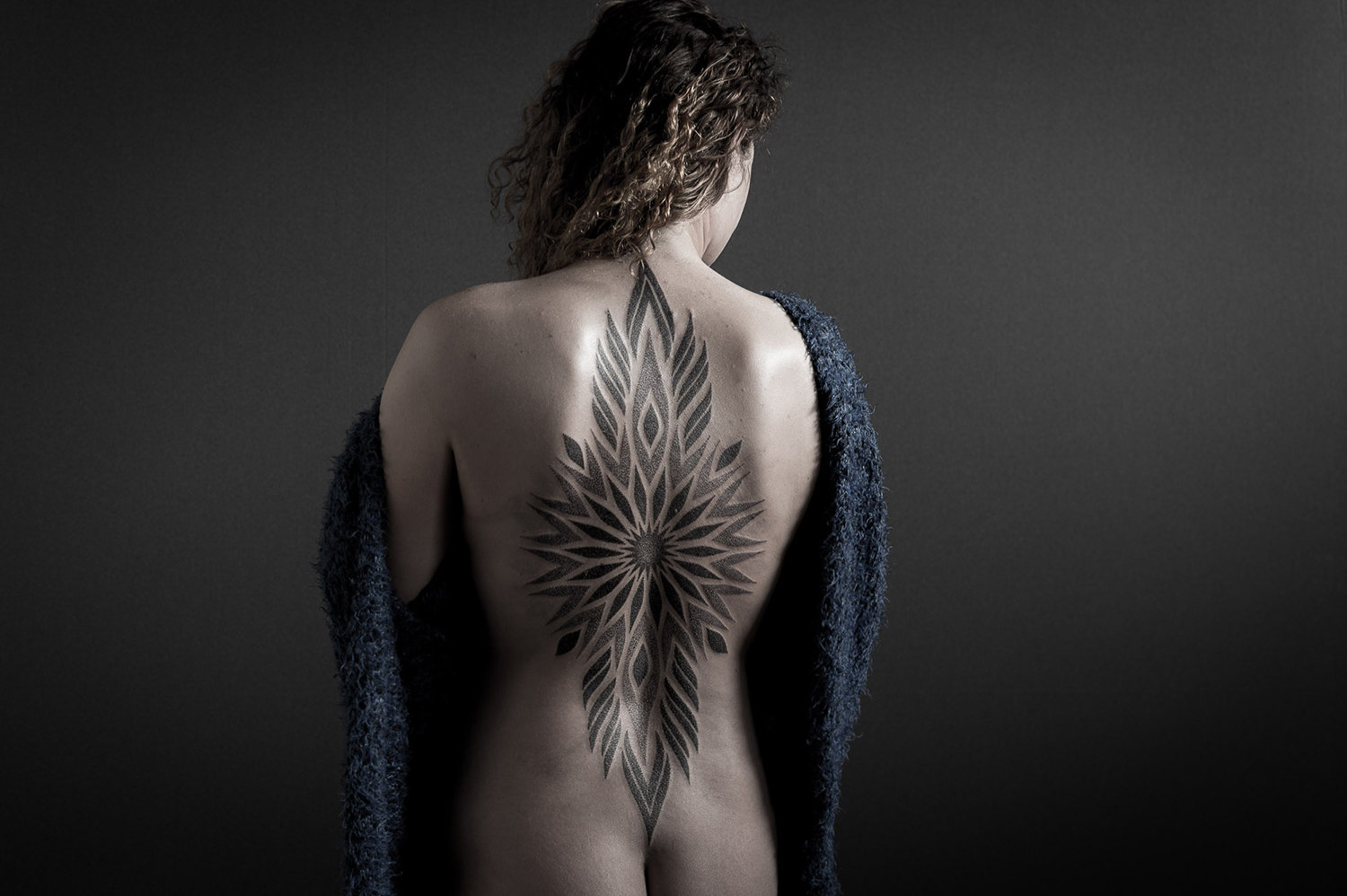 spiritual blackwork tattoo on back by paradox