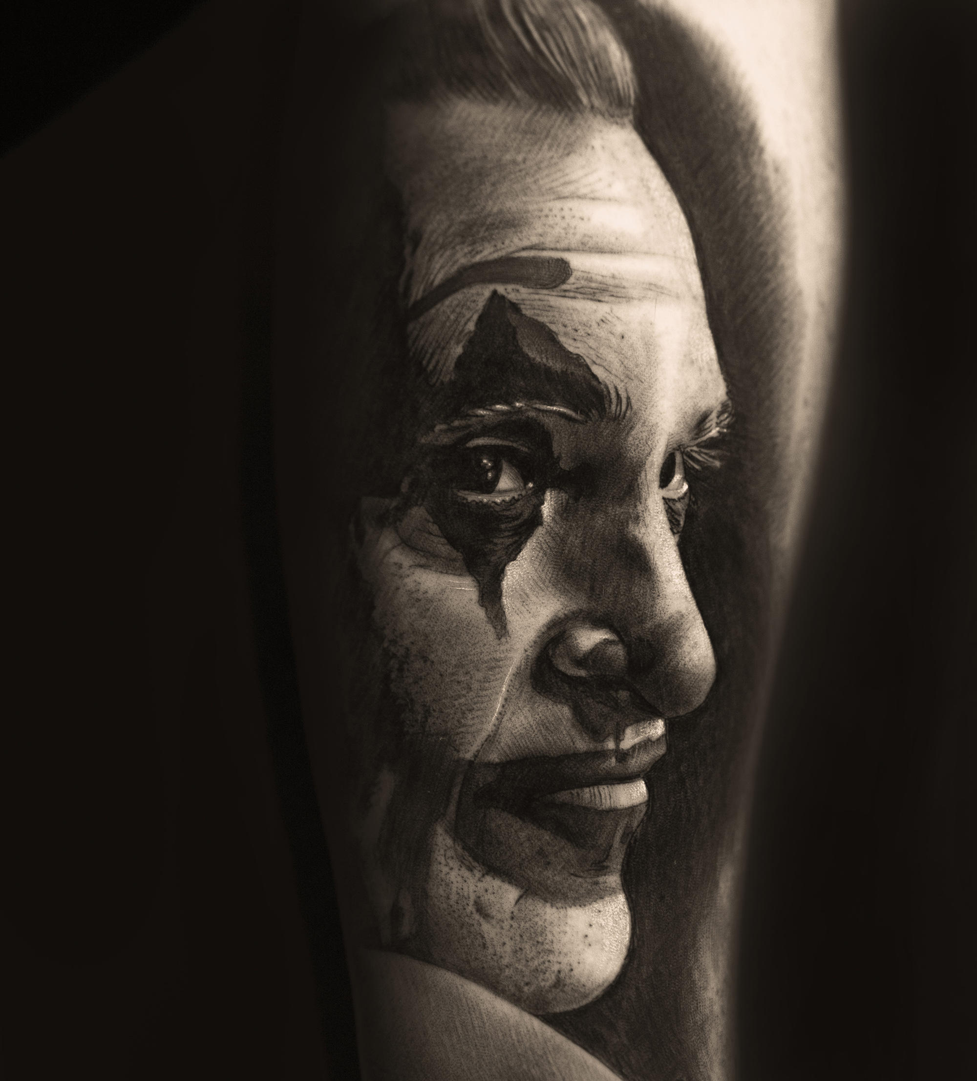 joker (joaquim phoenix) portrait tattoo in black and grey by Denis "Tidan" Torikashvili 