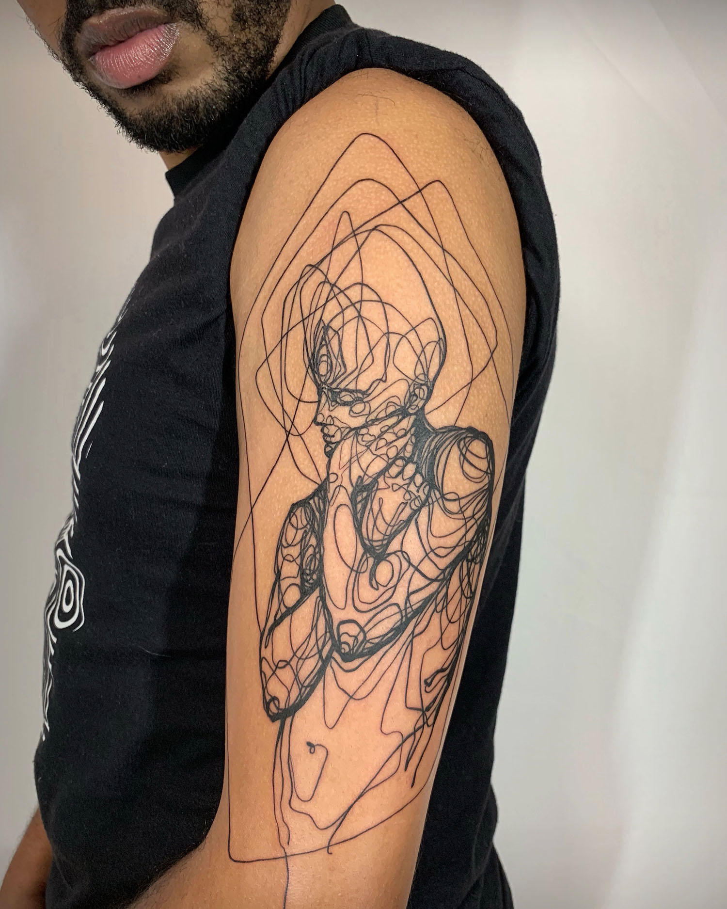 pain tattoo, on darker skin, arm, by jio maia