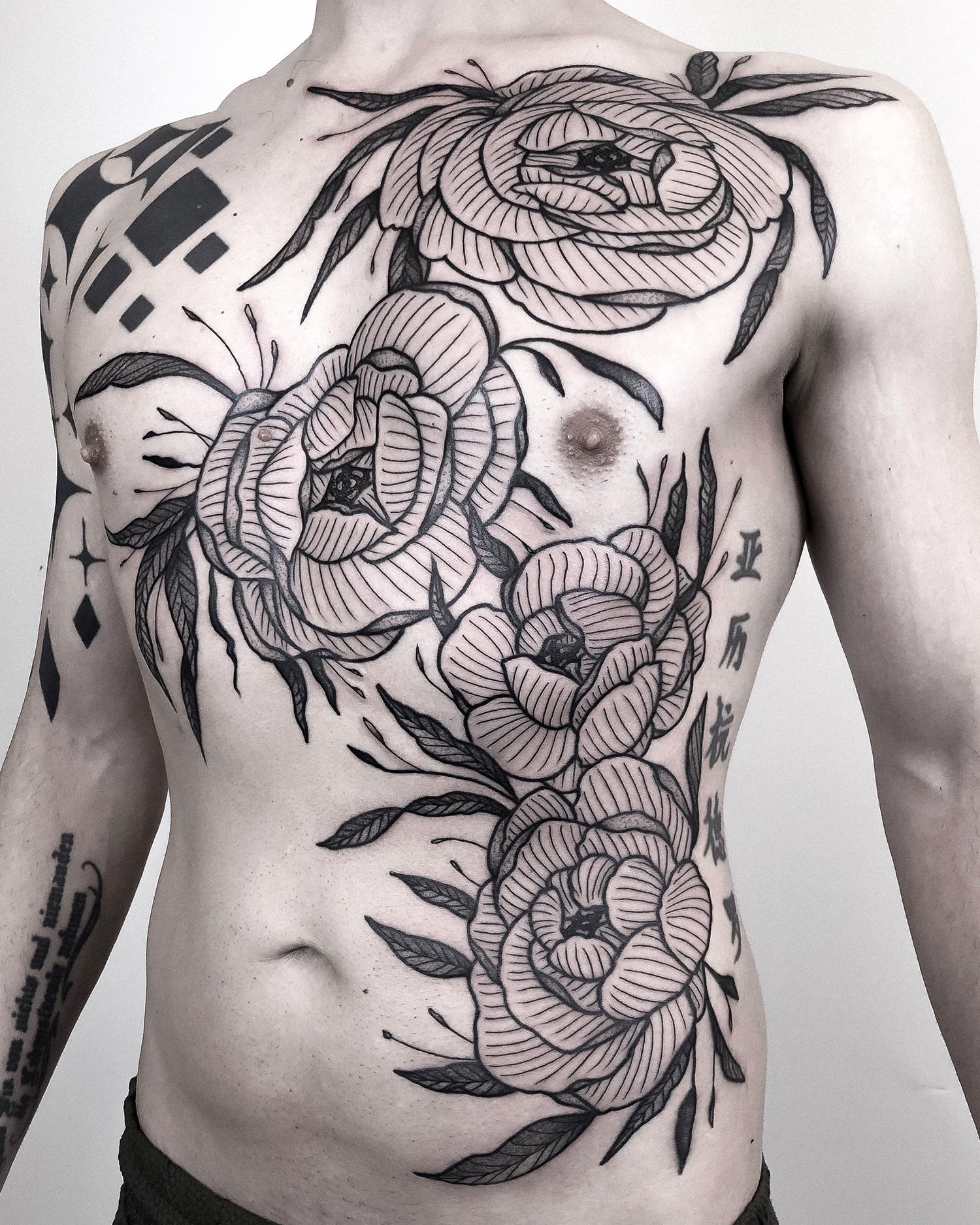 flowers on chest, botanical tattoos