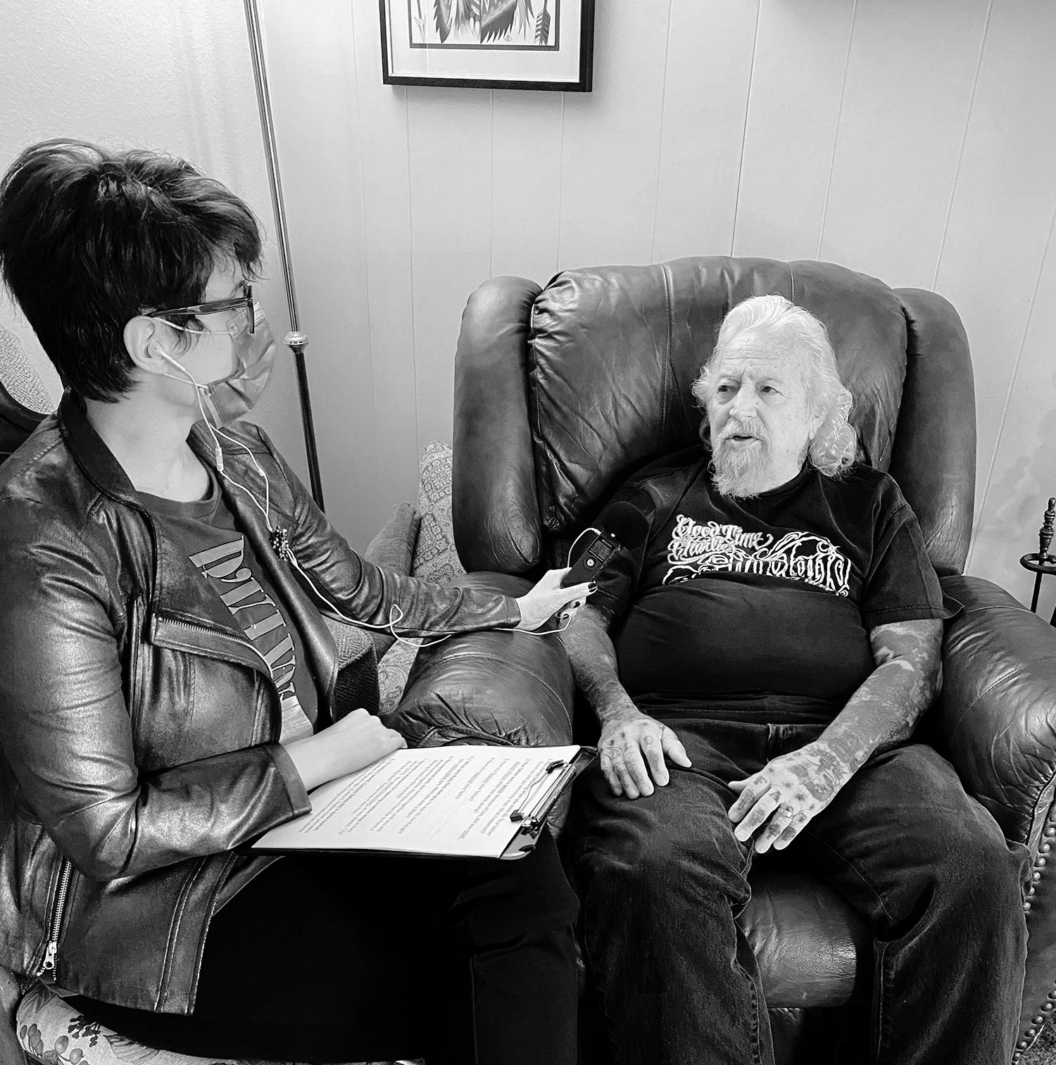 Adriana de Barros (tattoo journalist) on left, and charlie cartwright (tattoo legend black and grey prison-style) on right, interview