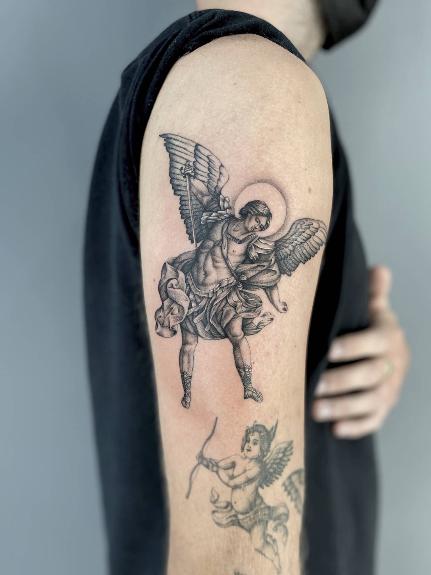 religious saint tattoo on arm, angels, by delphin musquet