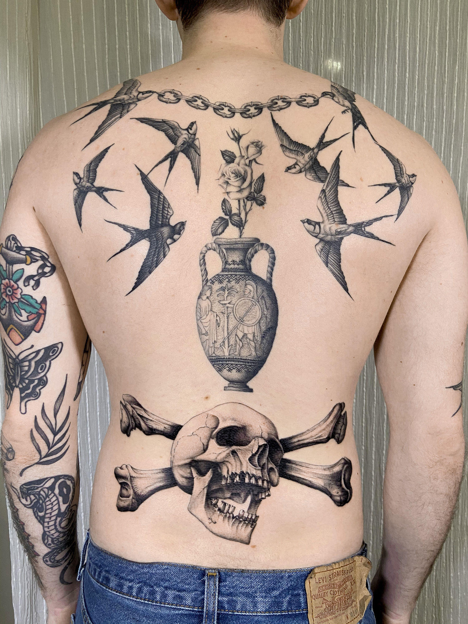 swallow fine-line tattoos on back, sang bleu london, skull tattoo