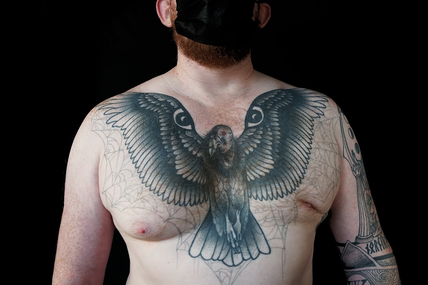 Along with the large bird on the chest, the client requested that it be surrounded by subtle spider webs.
