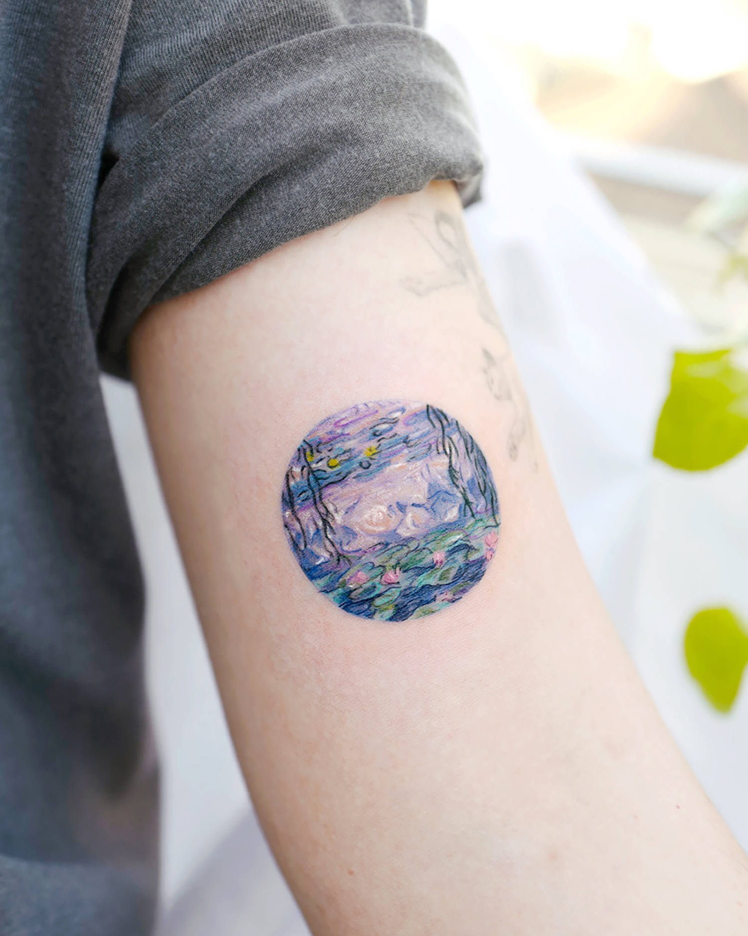 Monet water lilies series served as an inspiration, tattoo