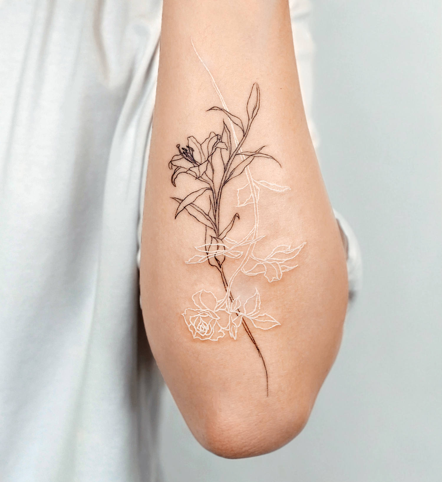 Although this tattoo is fresh, white ink heals differently than other inks.