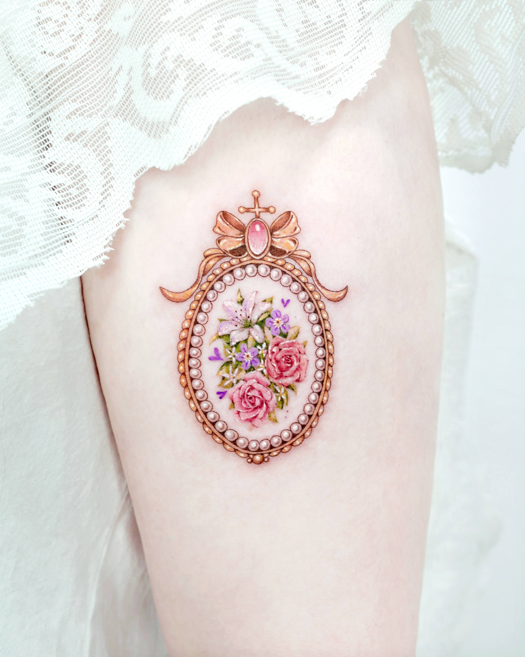 A recreation of a vintage ceramic brooch. Tattoo by Solar
