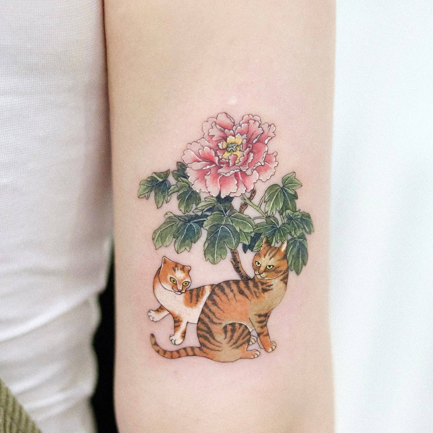 traditional cats and flowers tattoo