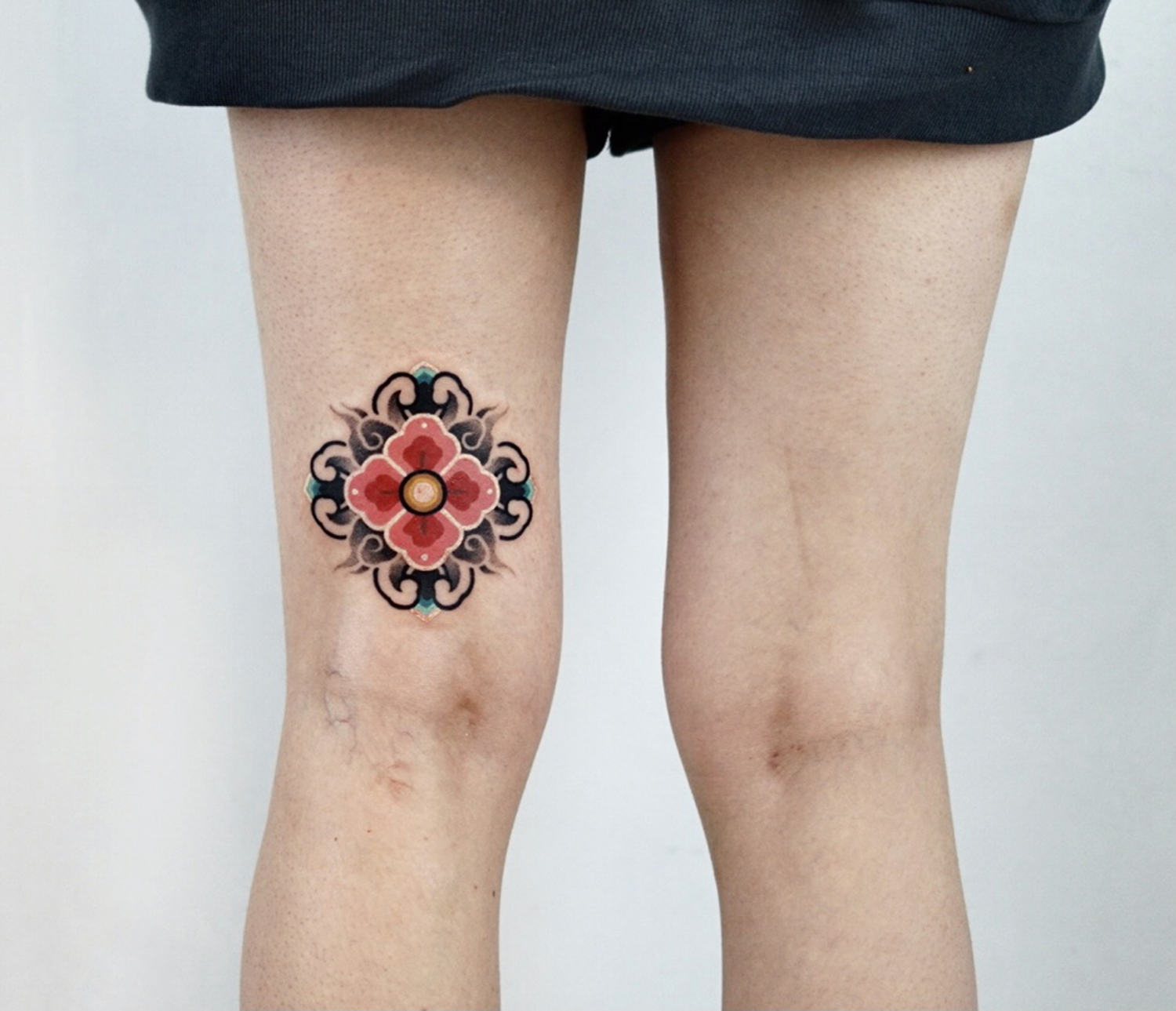 Korean mandala on leg, micro tattoo by kiwa
