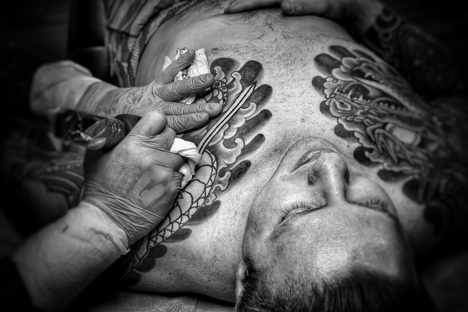 Tattooing the Hikae chest panel on client Smoleg