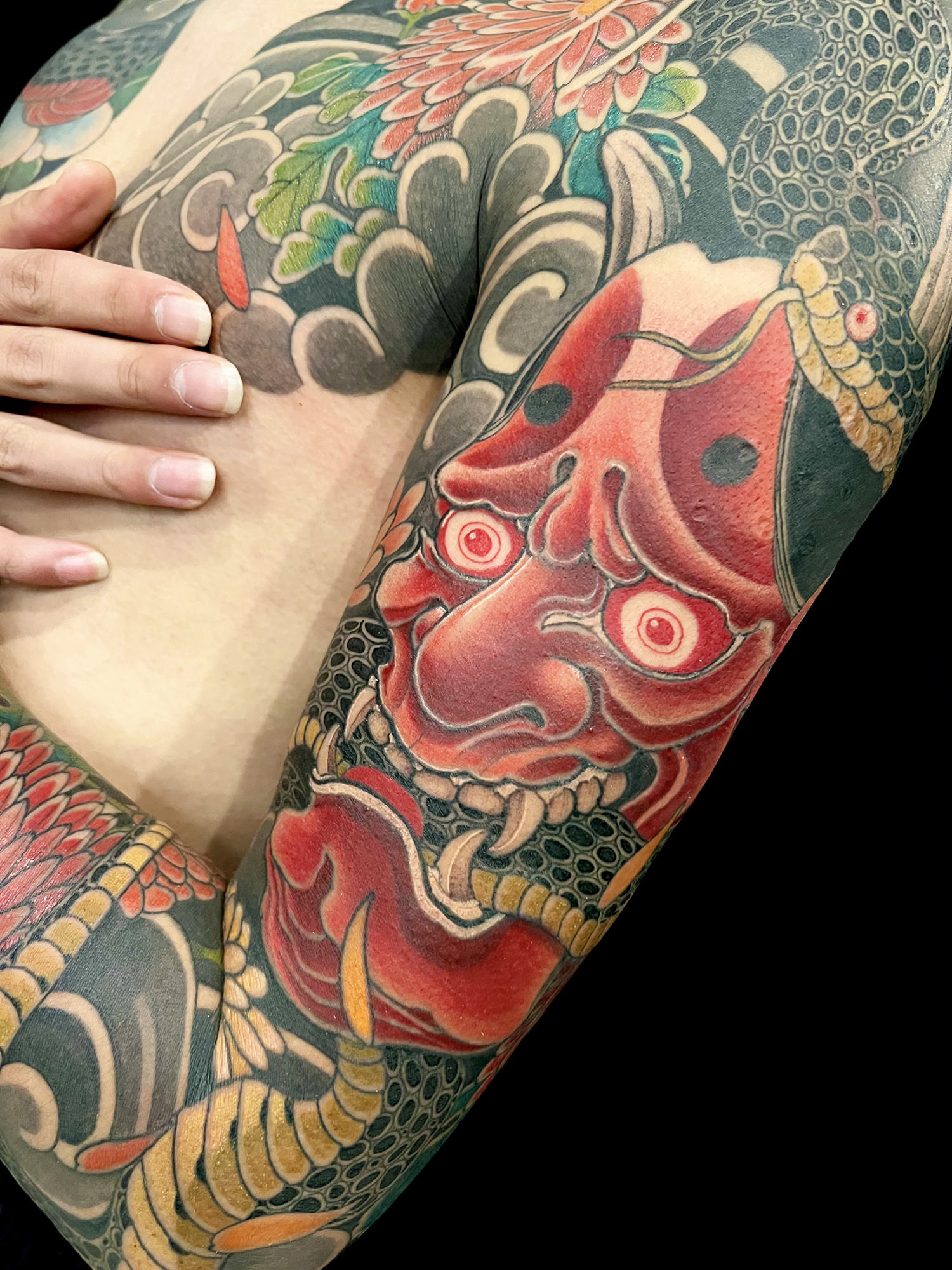A tattoo depicting a Hannya mask from Japanese Noh theater.