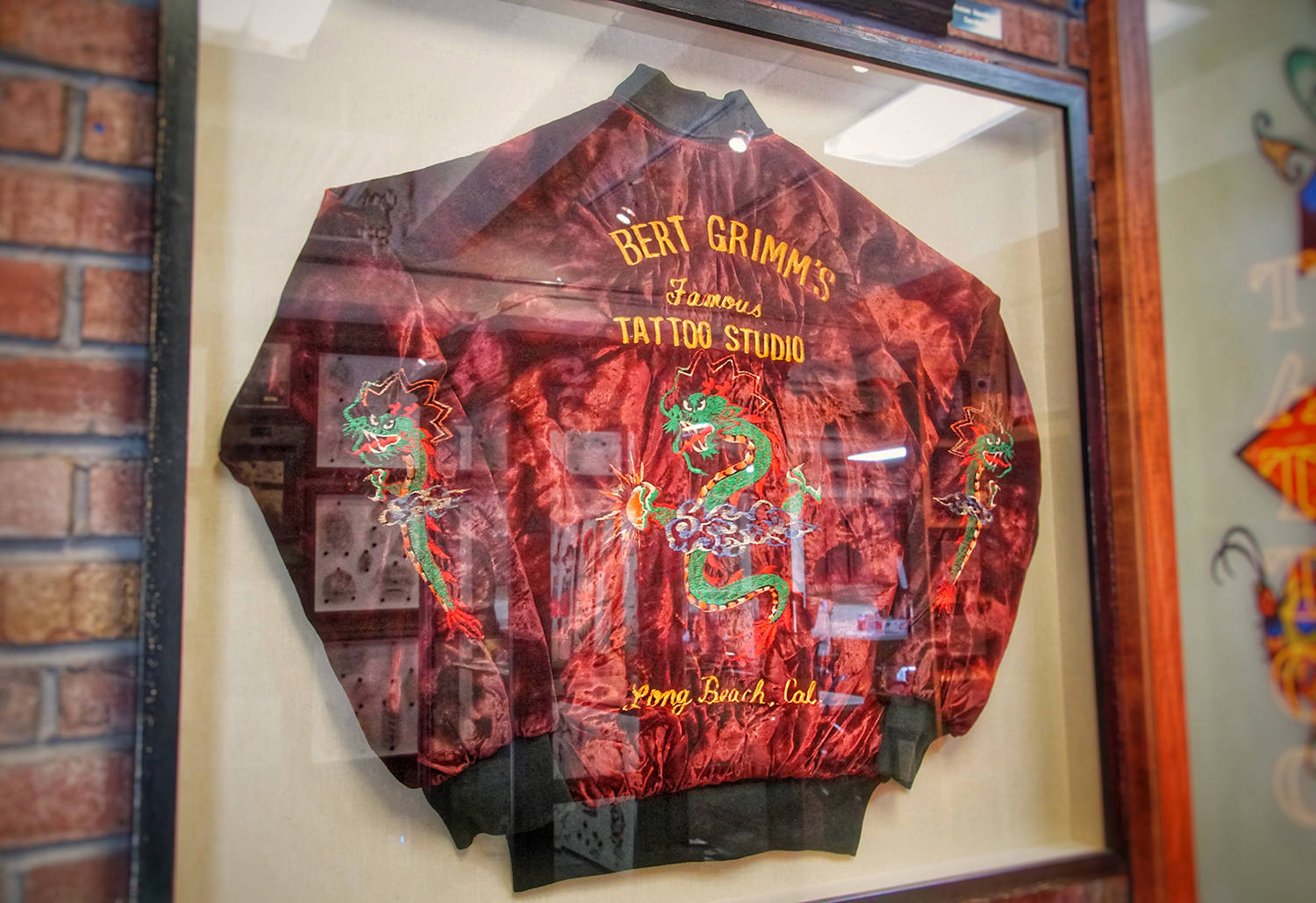 A rick walters jacket donated to outer limits. Embroidery of Bert grimms famous tattoo studio  - photo by the tattoo journalist