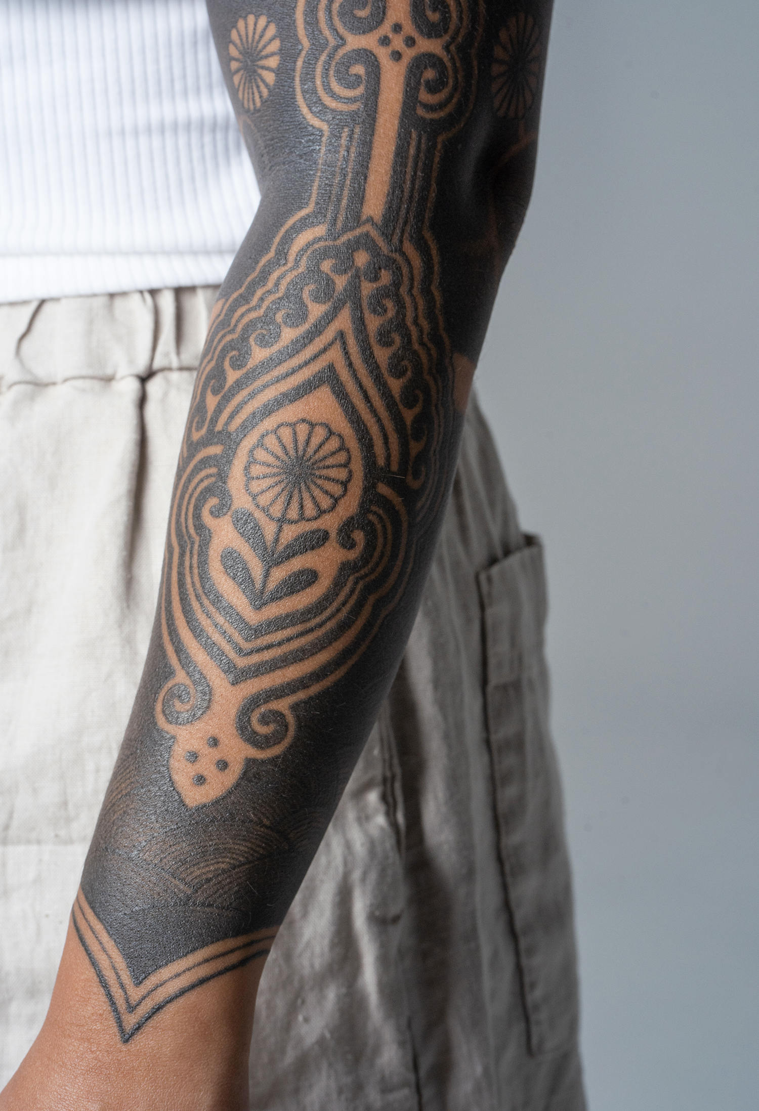 A part of a tattooed sleeve detail emanates exquisite beauty up close