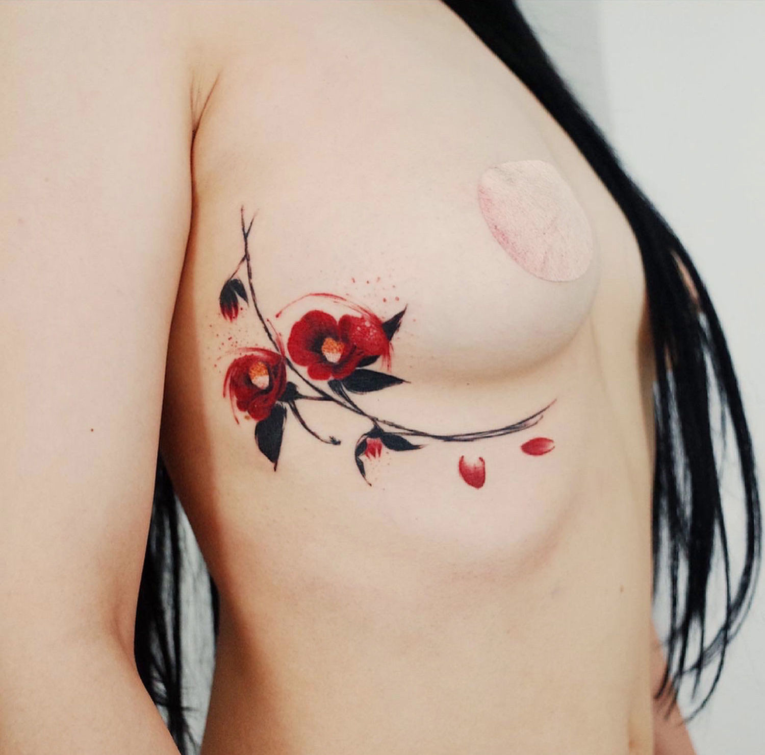 flower painting style tattoo, black and red
