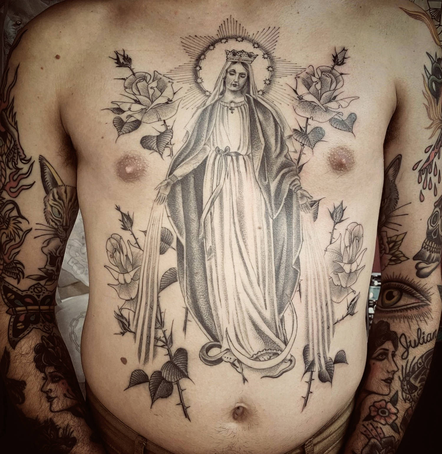 blessed mother tattoo on stomach
