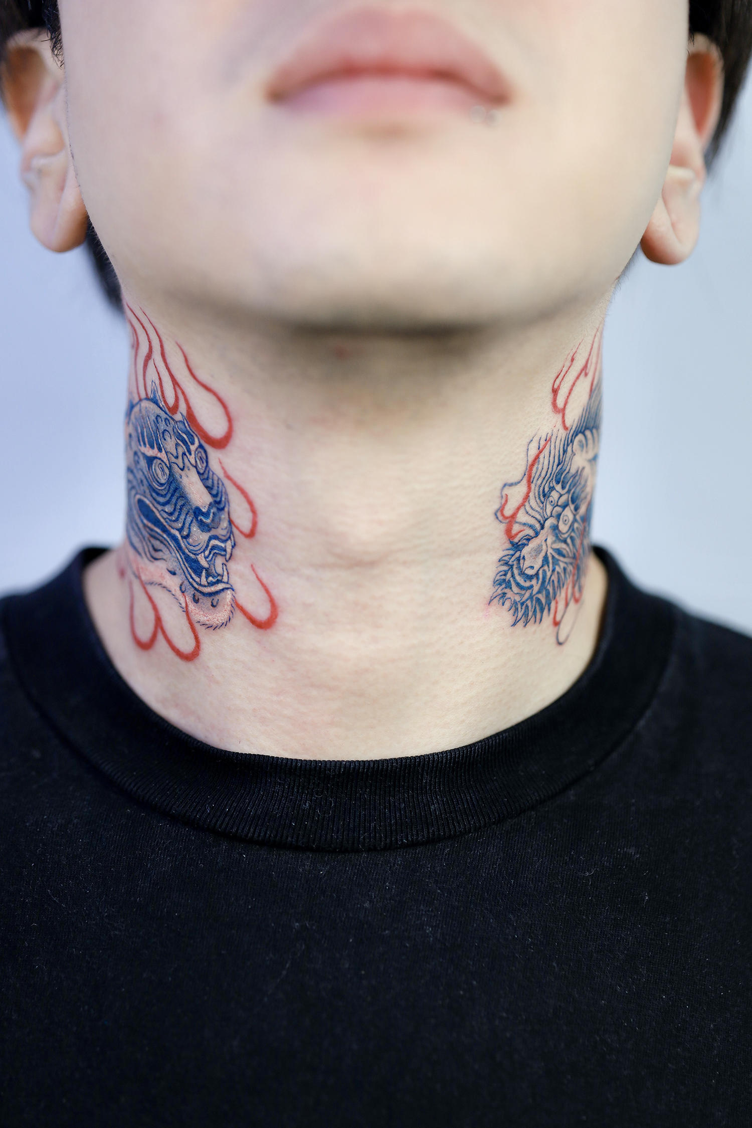 korean tiger and dragon on neck, tattoos in blue ink
