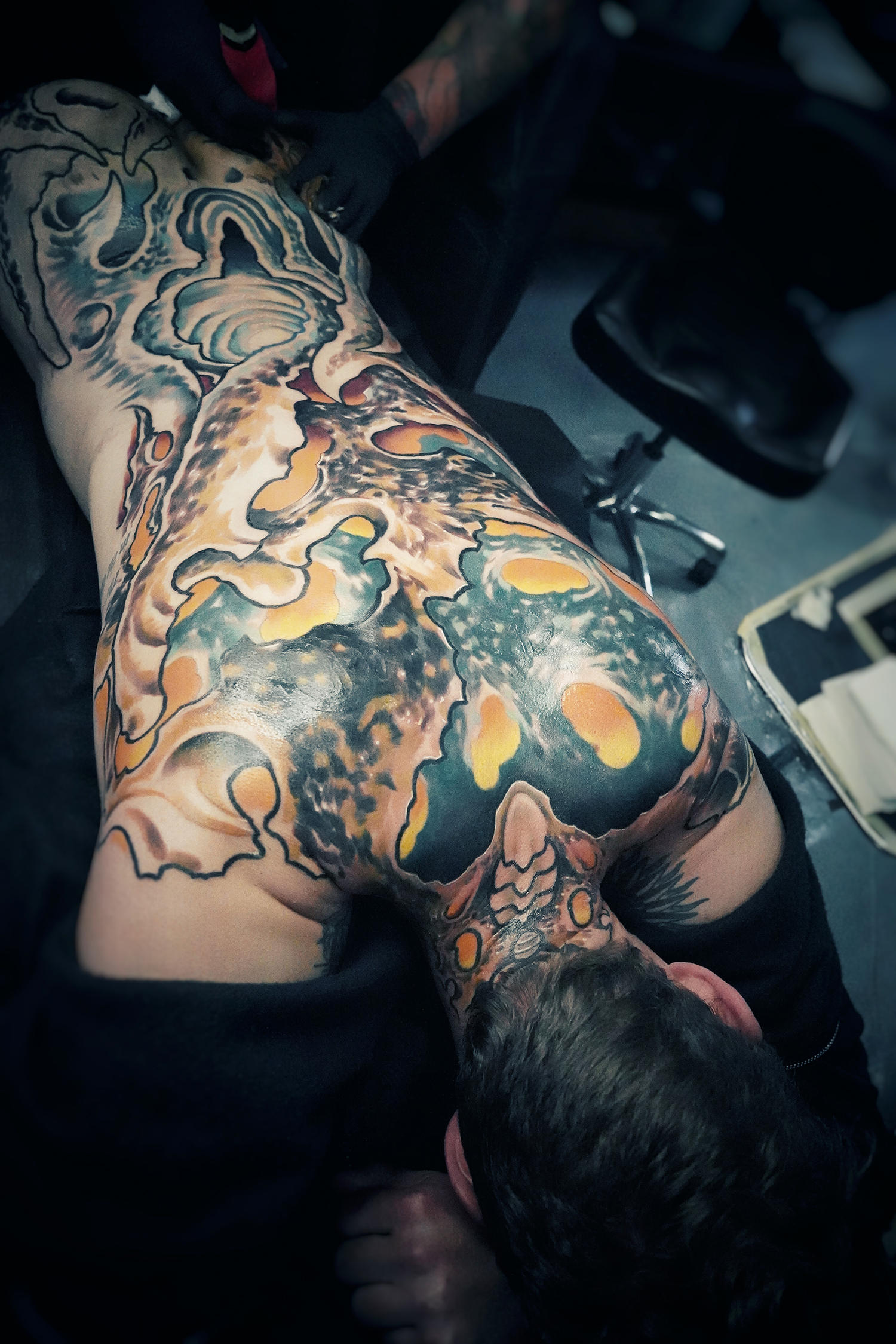 largescale bio-organic back tattoo in color