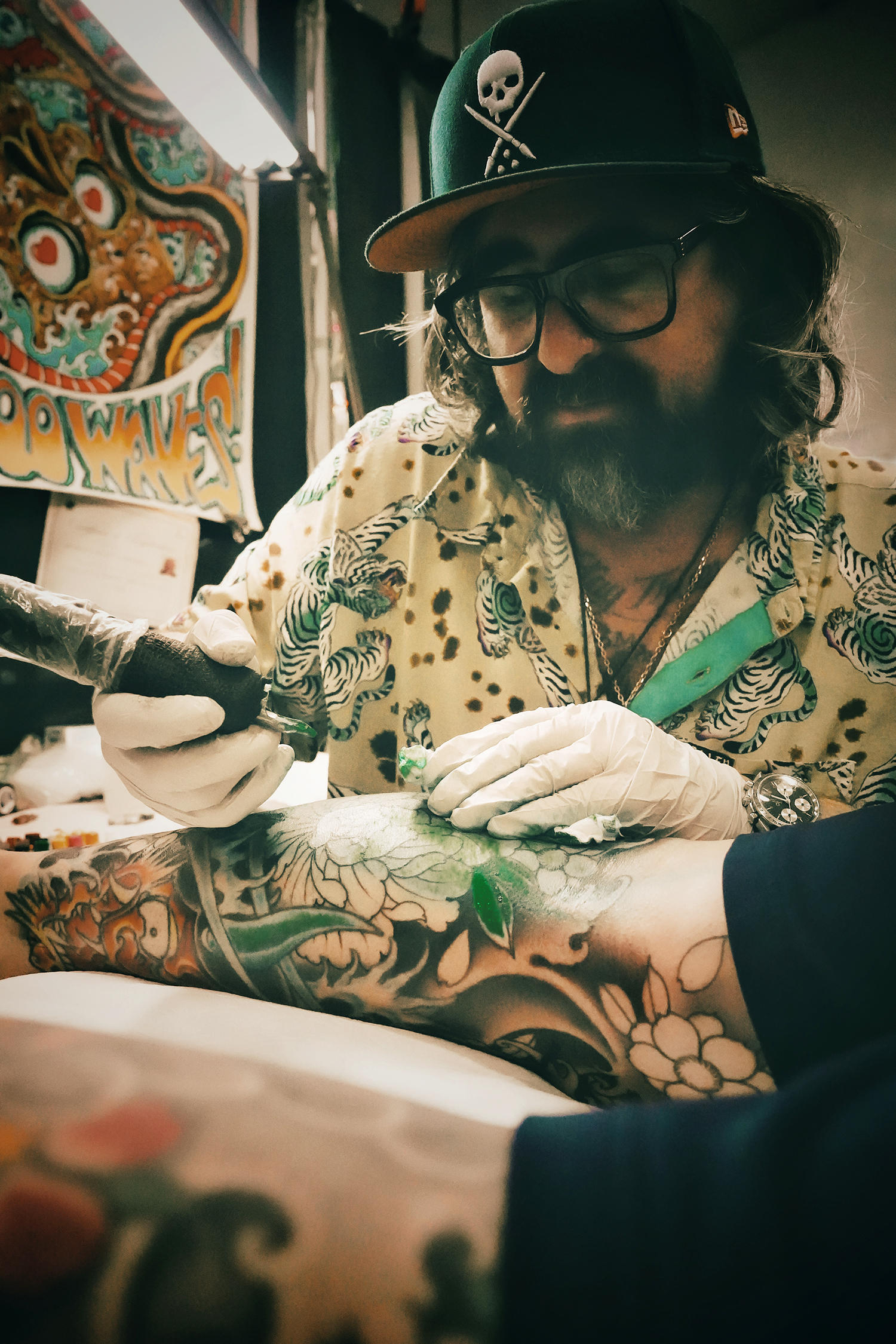 legend robert atkinson doing japanese floral tattoo