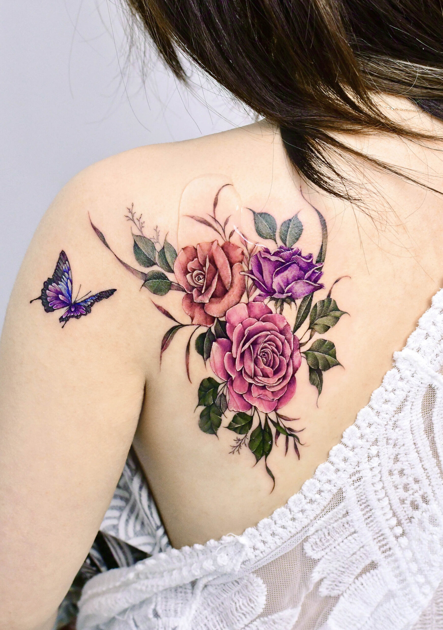roses and butterfly tattoo on shoulder, color