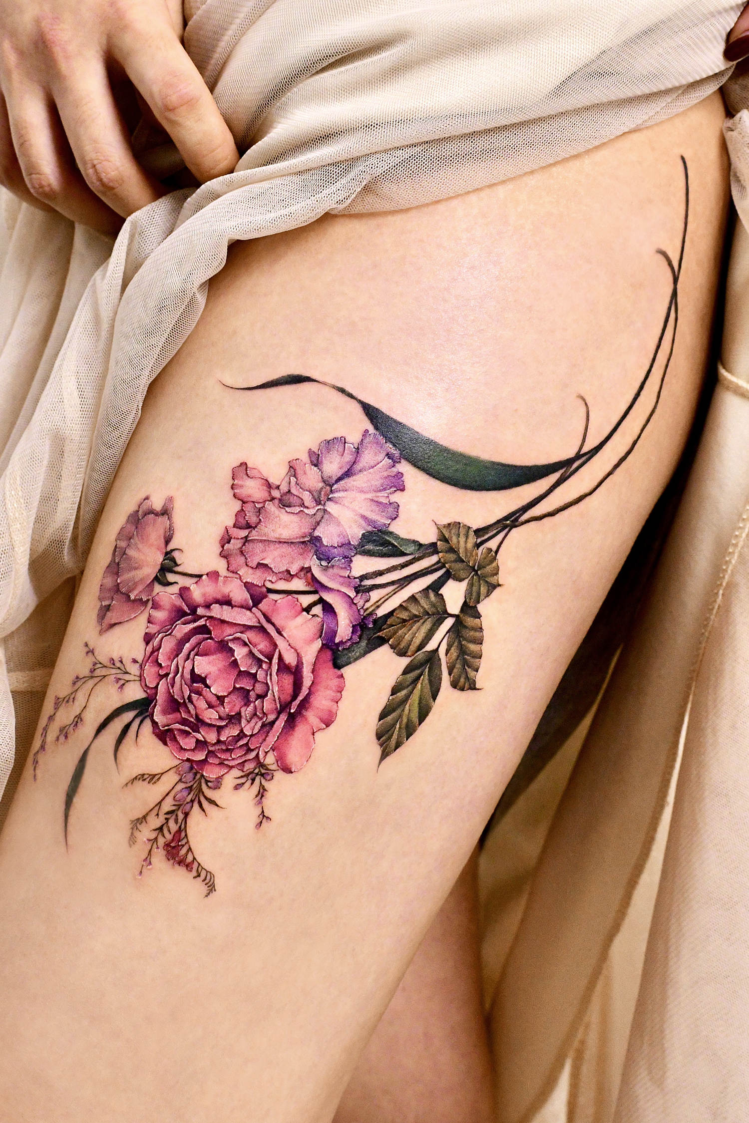 rose pink flower tattoo on thigh