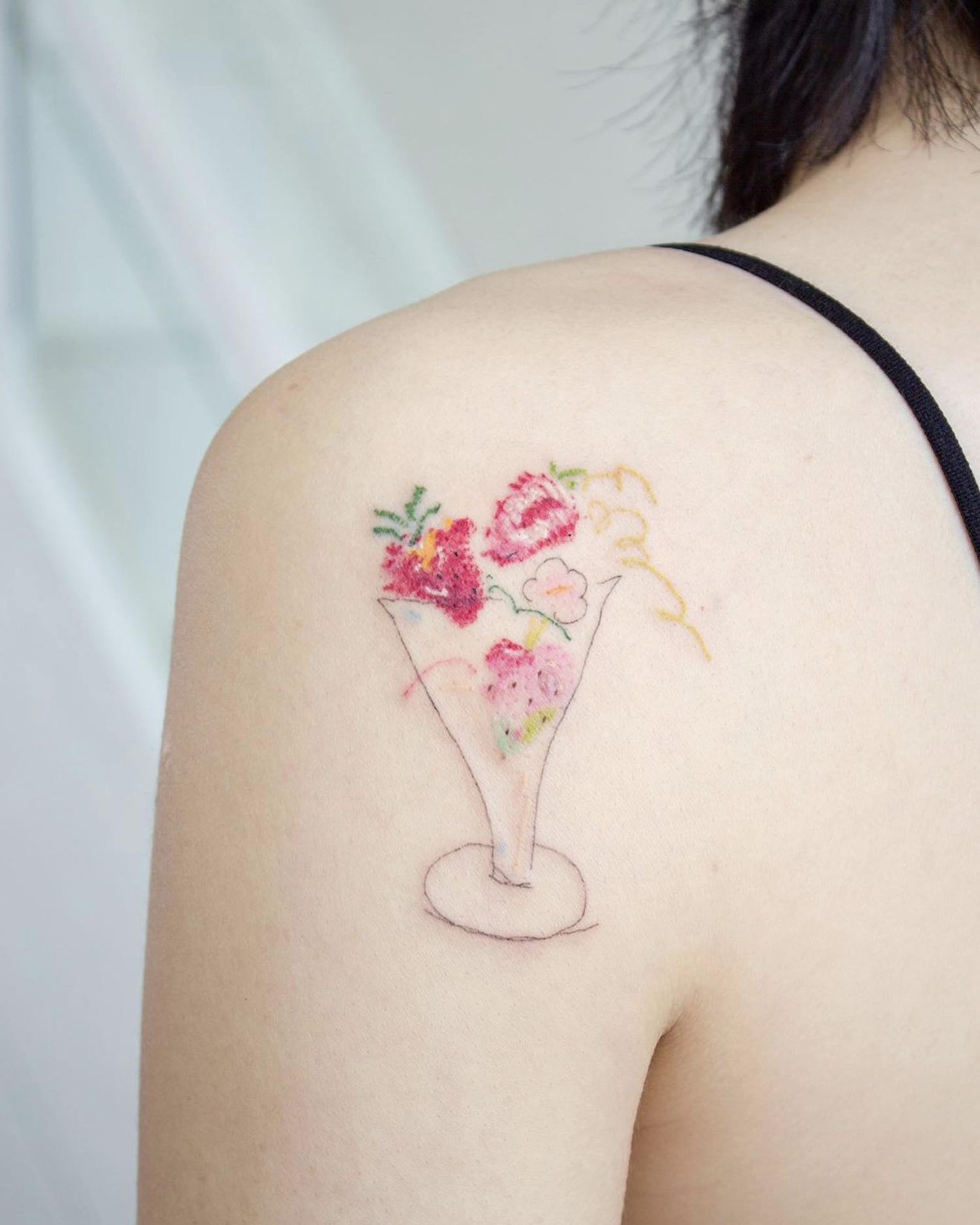 strawberry cocktail drawing tattoo on shoulder