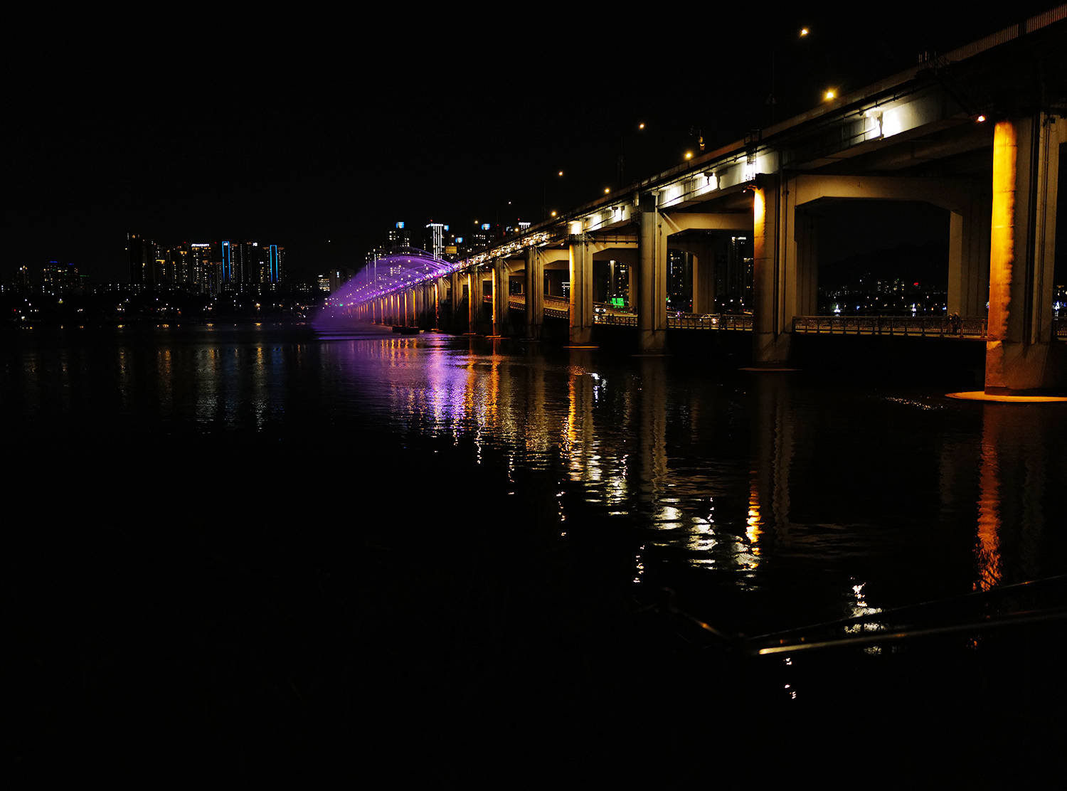 a view of seoul skyline and bridge from the han river in south korea