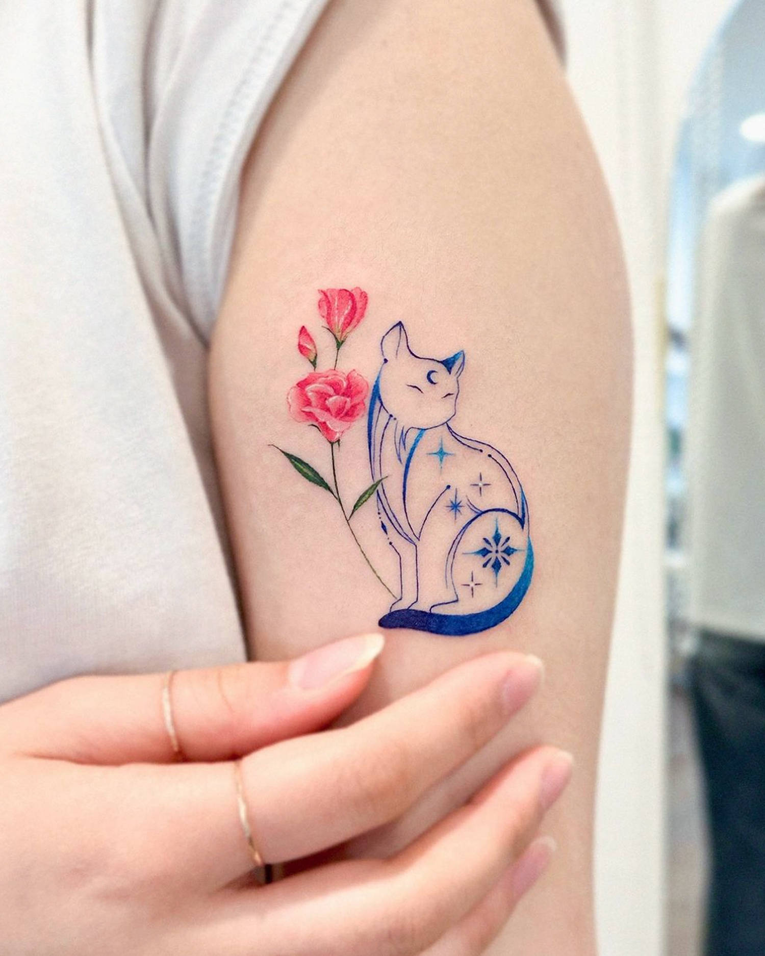 rose and blue cat tattoo