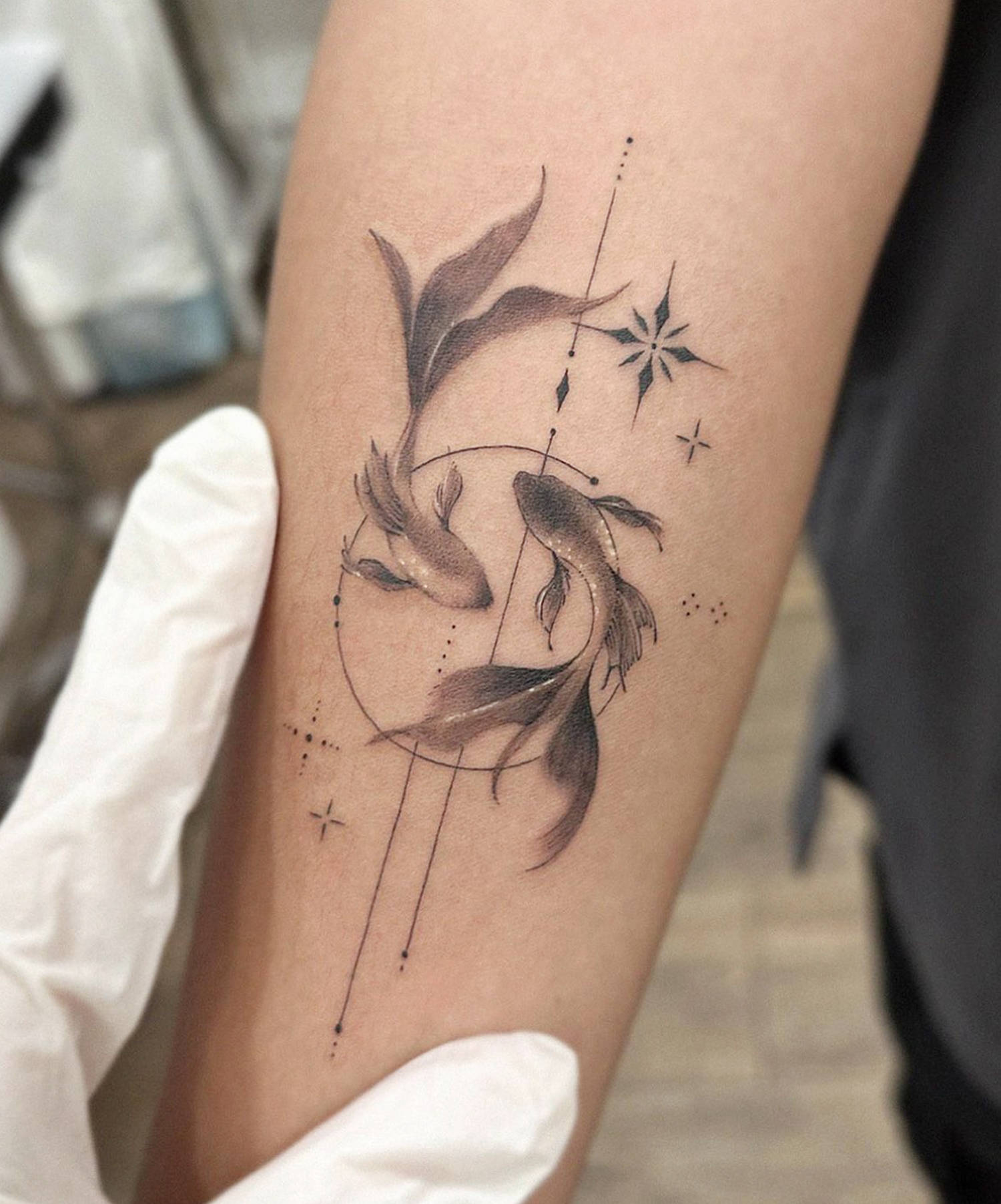 goldfish tattoo in black and grey