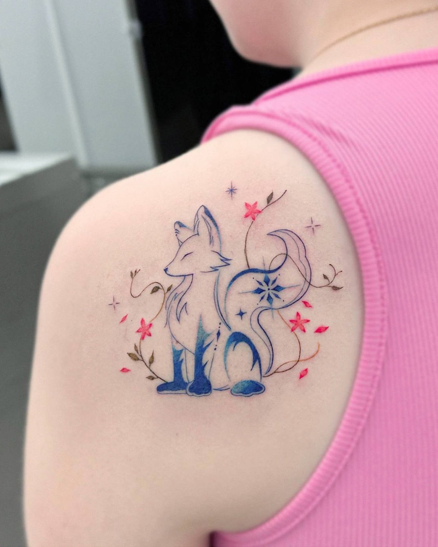 sparkle fox tattoo on shoulder blue and pink