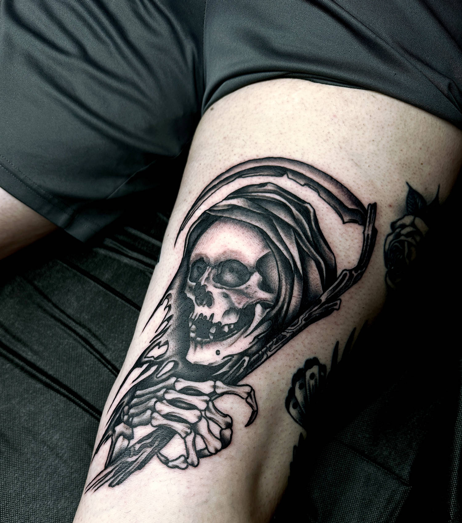 grim reaper tattoo in black ink by mark clifford