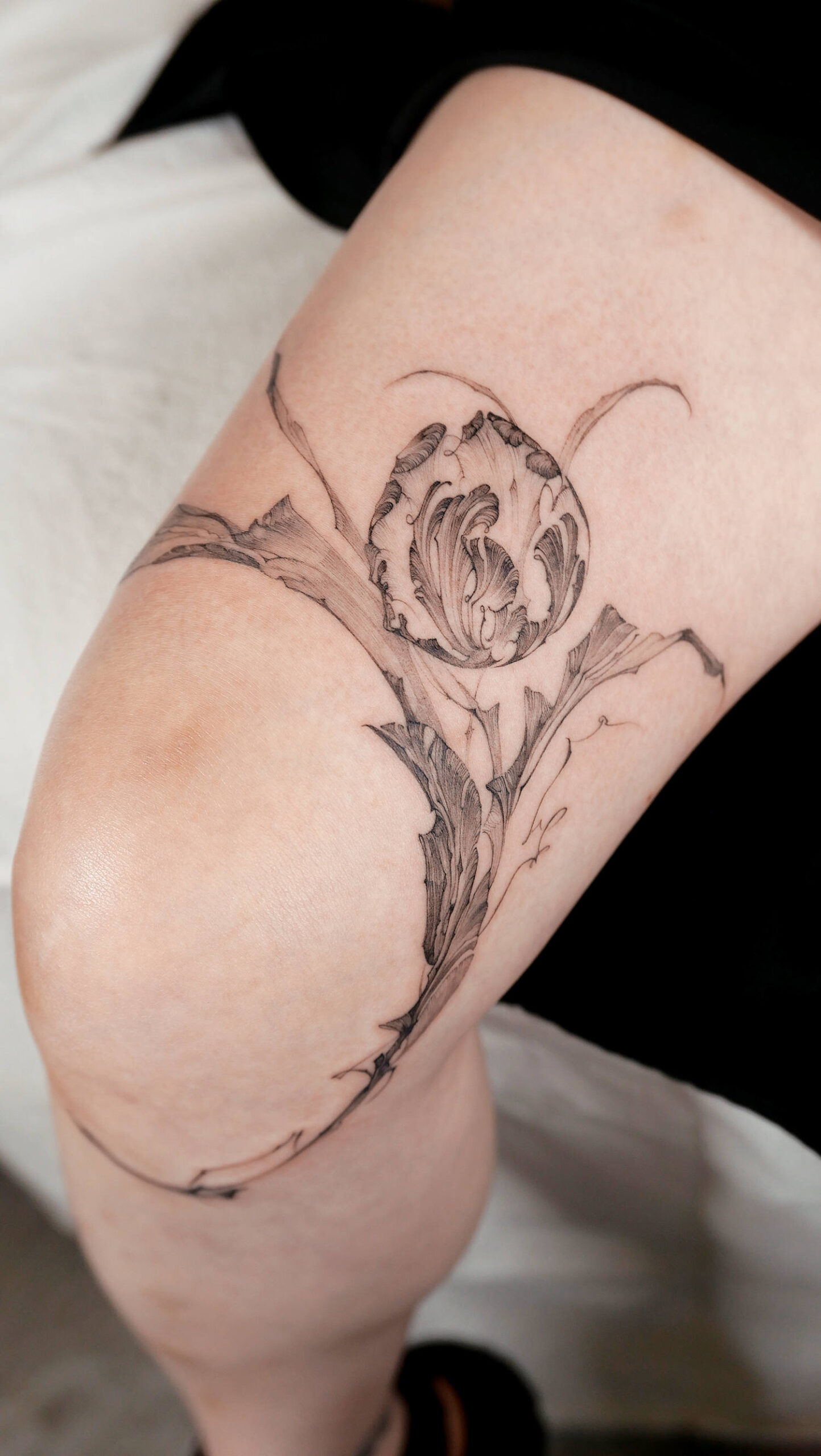 flower tattoo on knee
