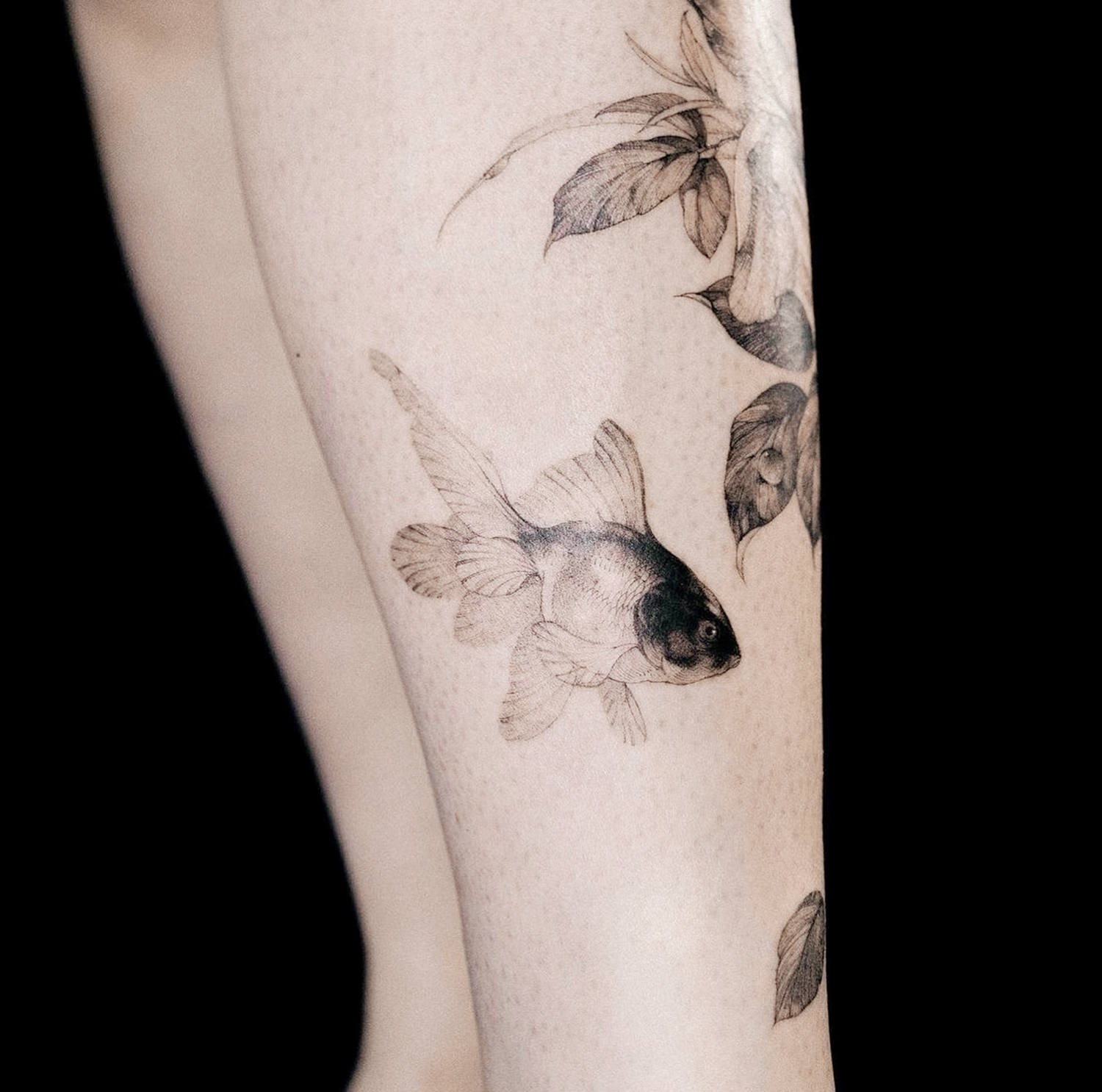 goldfish fine line tattoo, black ink