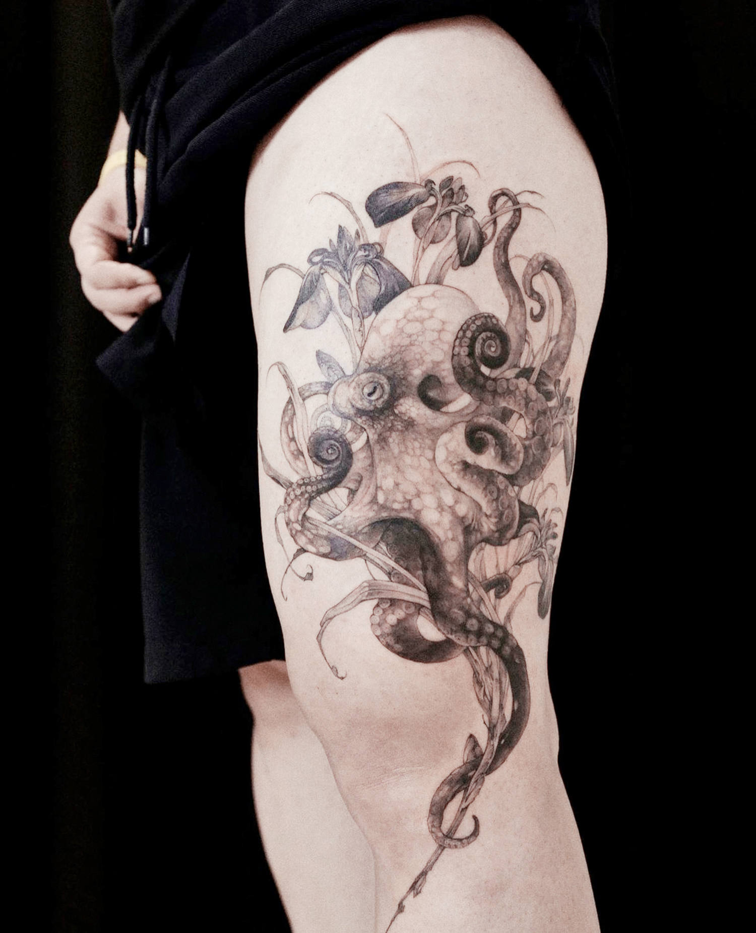 octopus and flower tattoo on thigh
