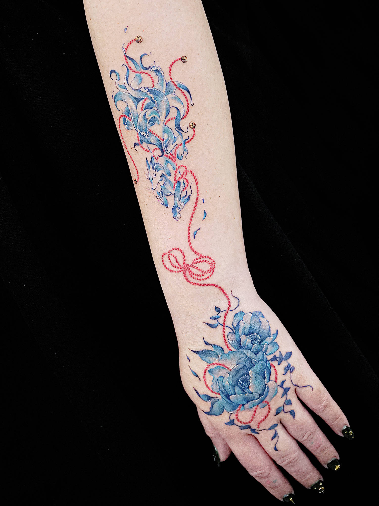flora and fauna tattoo on arm, blue ink