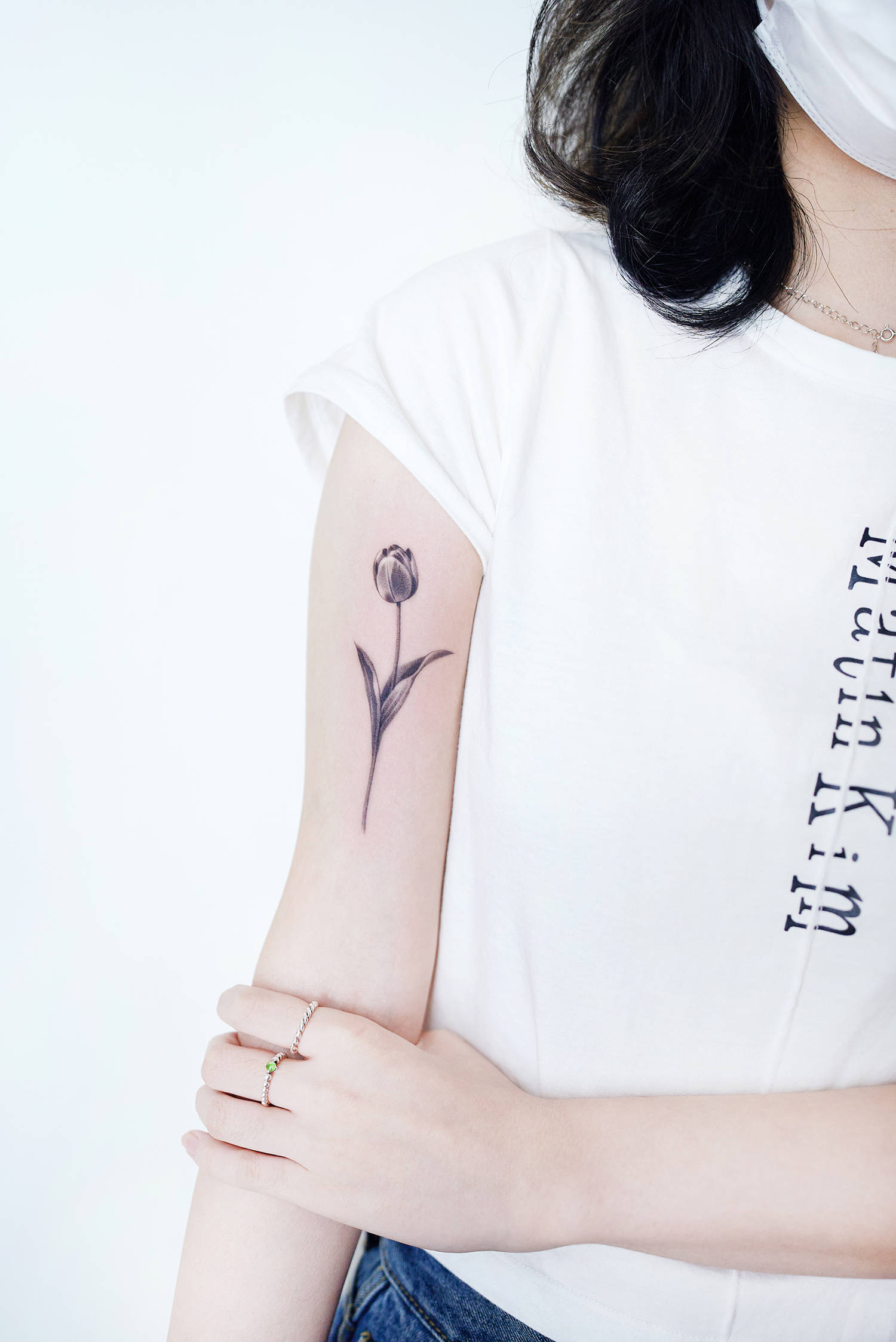 black and grey tulip tattoo on arm