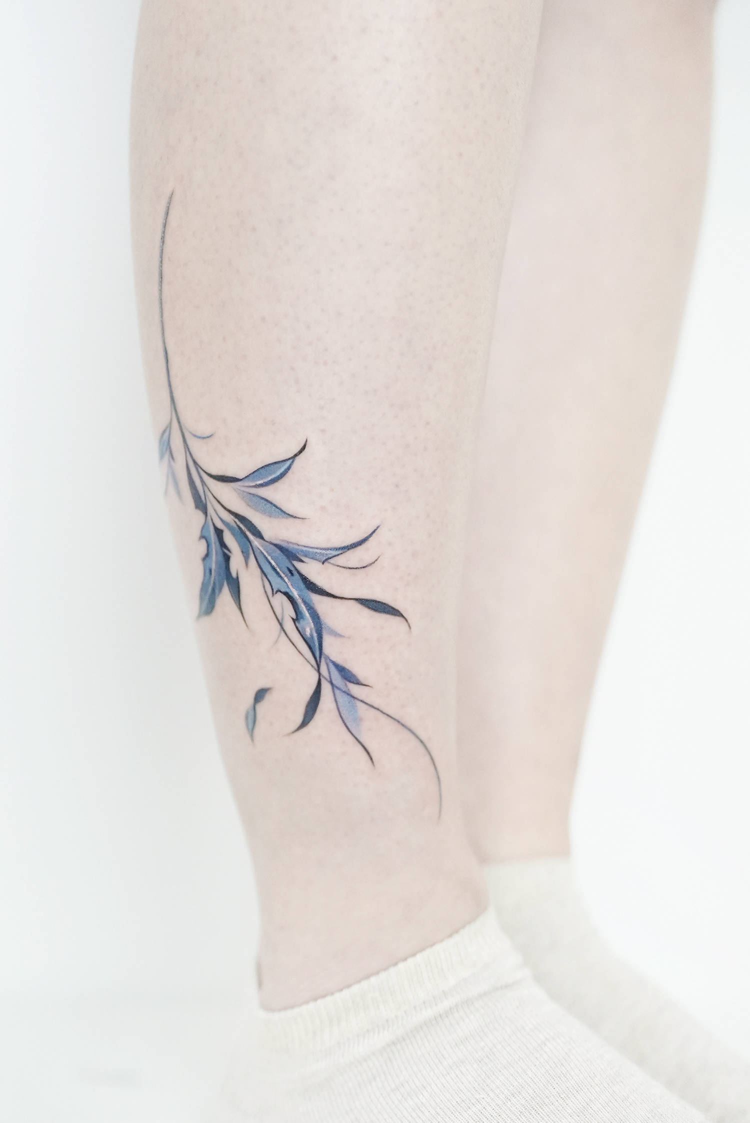 wild plant tattoo in blue tone
