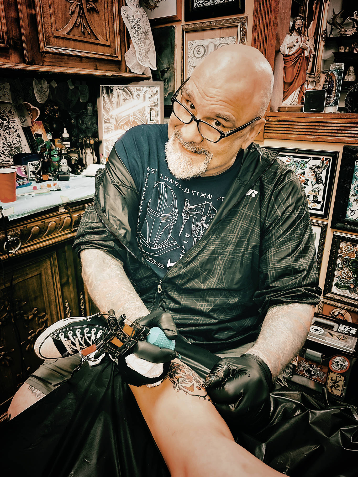 A portrait of tattoo legend big frank at secret kingdom tattoo shop, courtesy of Frank