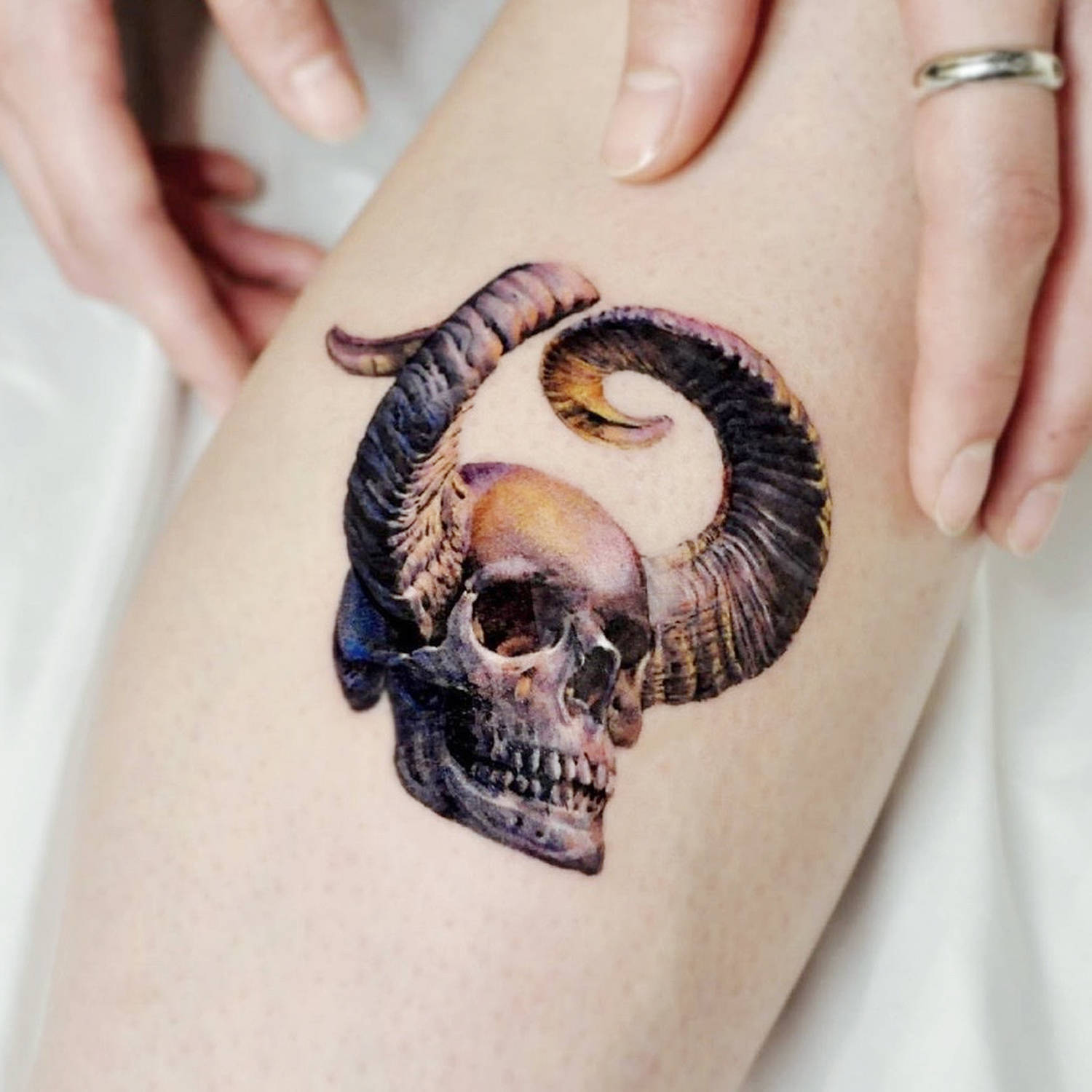 horned human skull tattoo