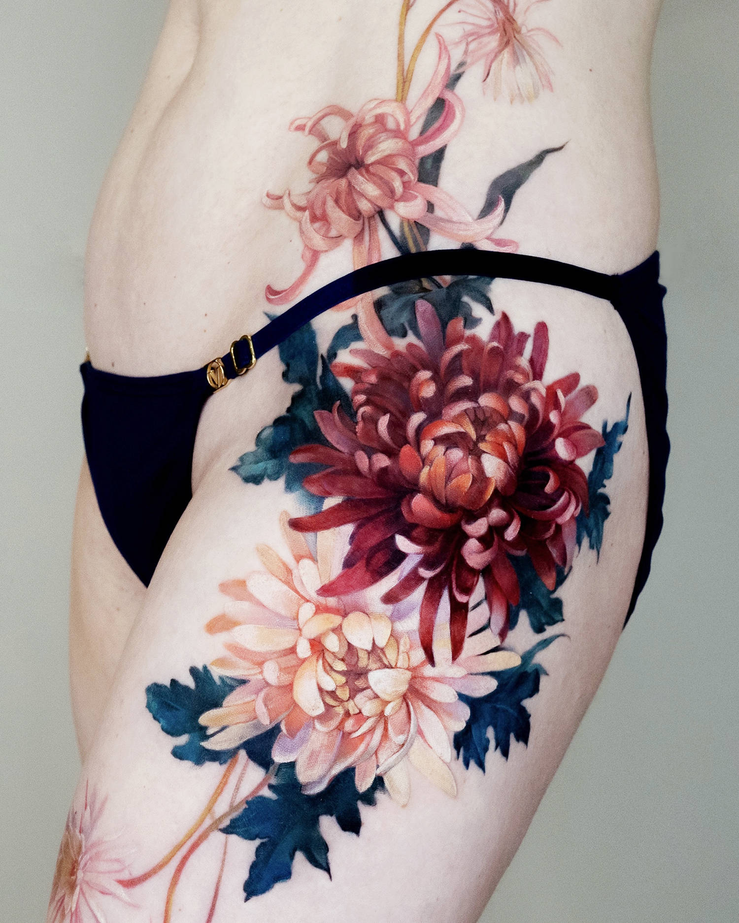 Chrysanthemums have evolved into a timeless tattoo motif