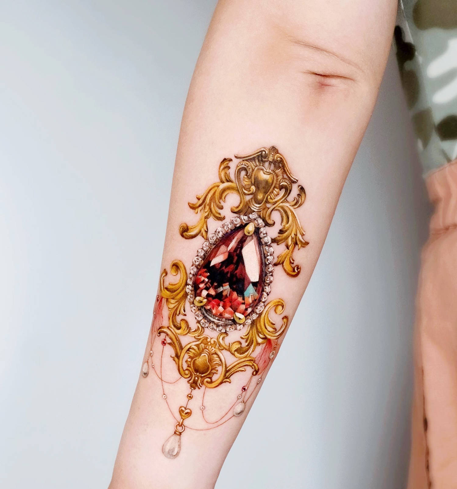 jewlery tattoo on arm by chou