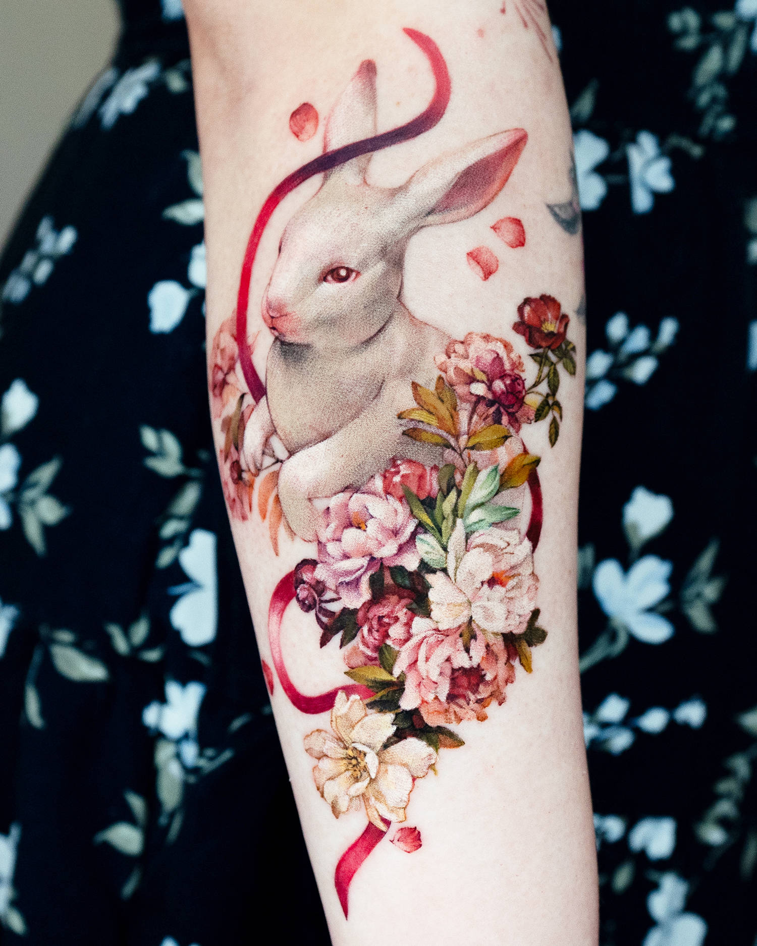 rabbit tattoo with flowers