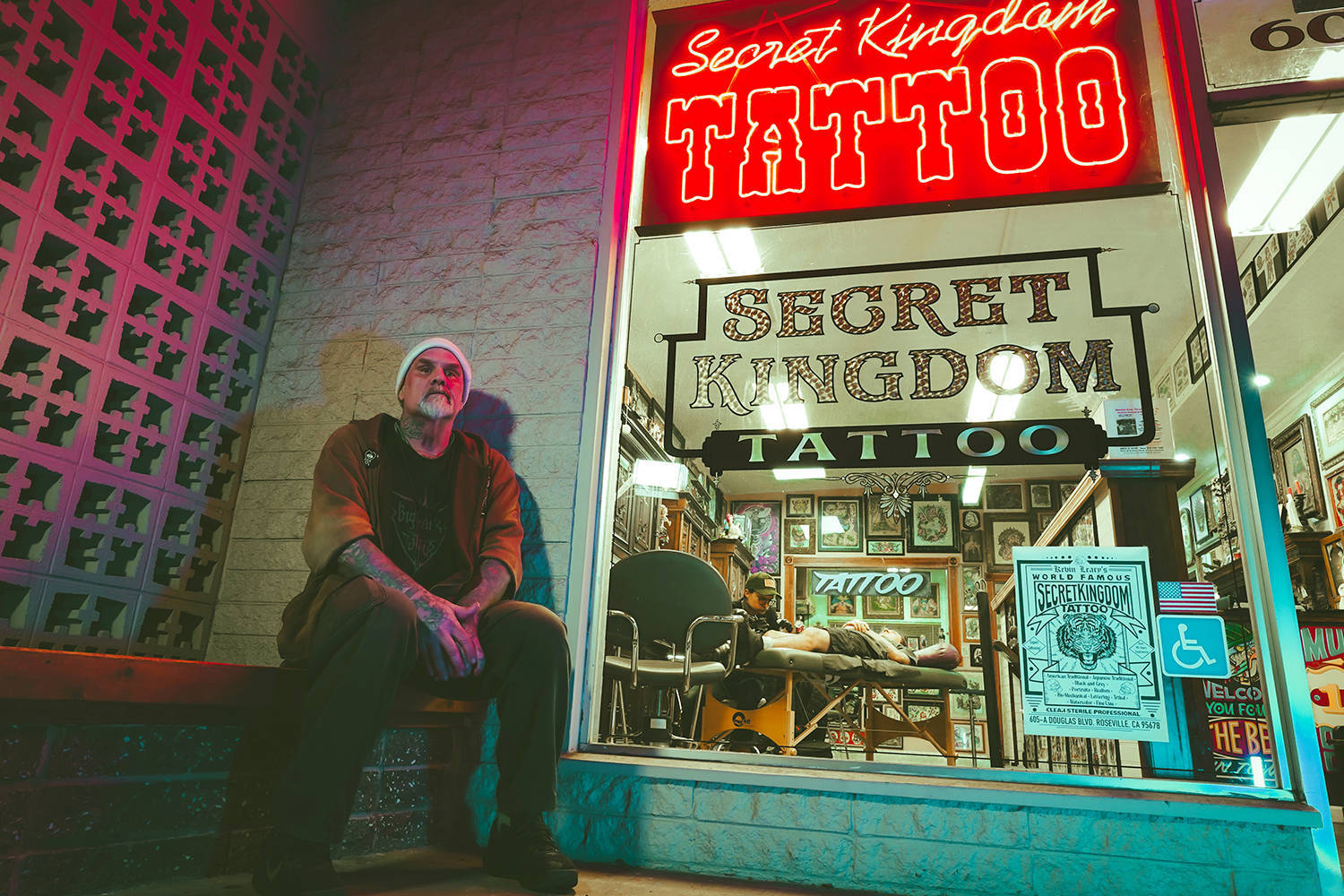 big frank portrait in front of secret kingdom tattoo shop, photo  copyright adriana the tattoo journalist