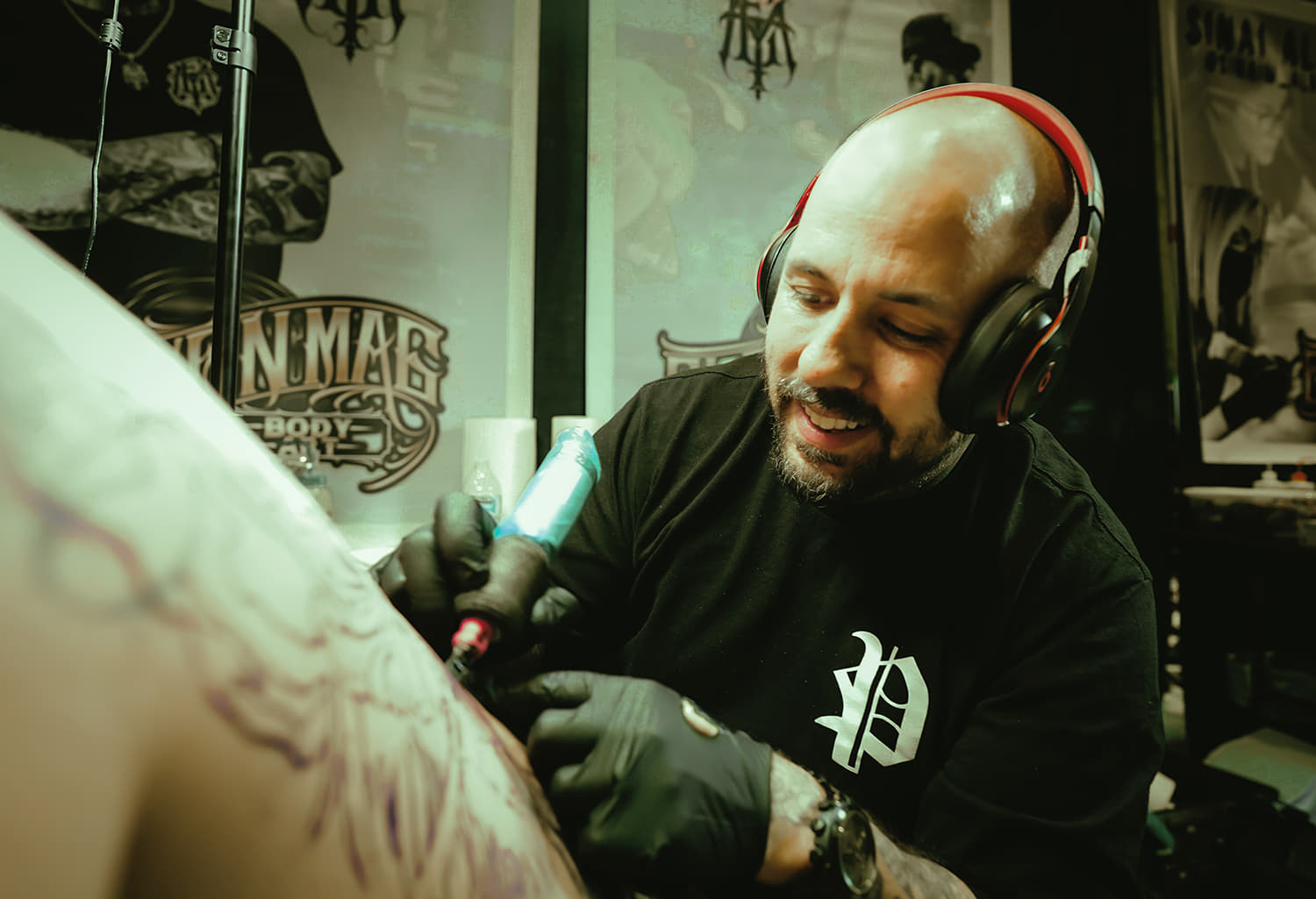 Jason Lawson is the owner of eleven mag tattoo shop in brentwood california photo copyright Adriana de Barros