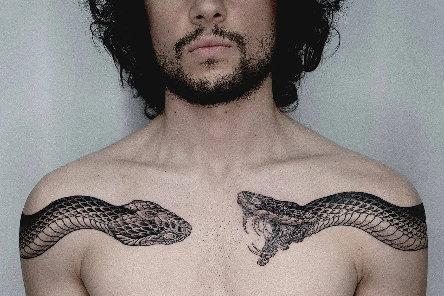 interconnected snake tattoos