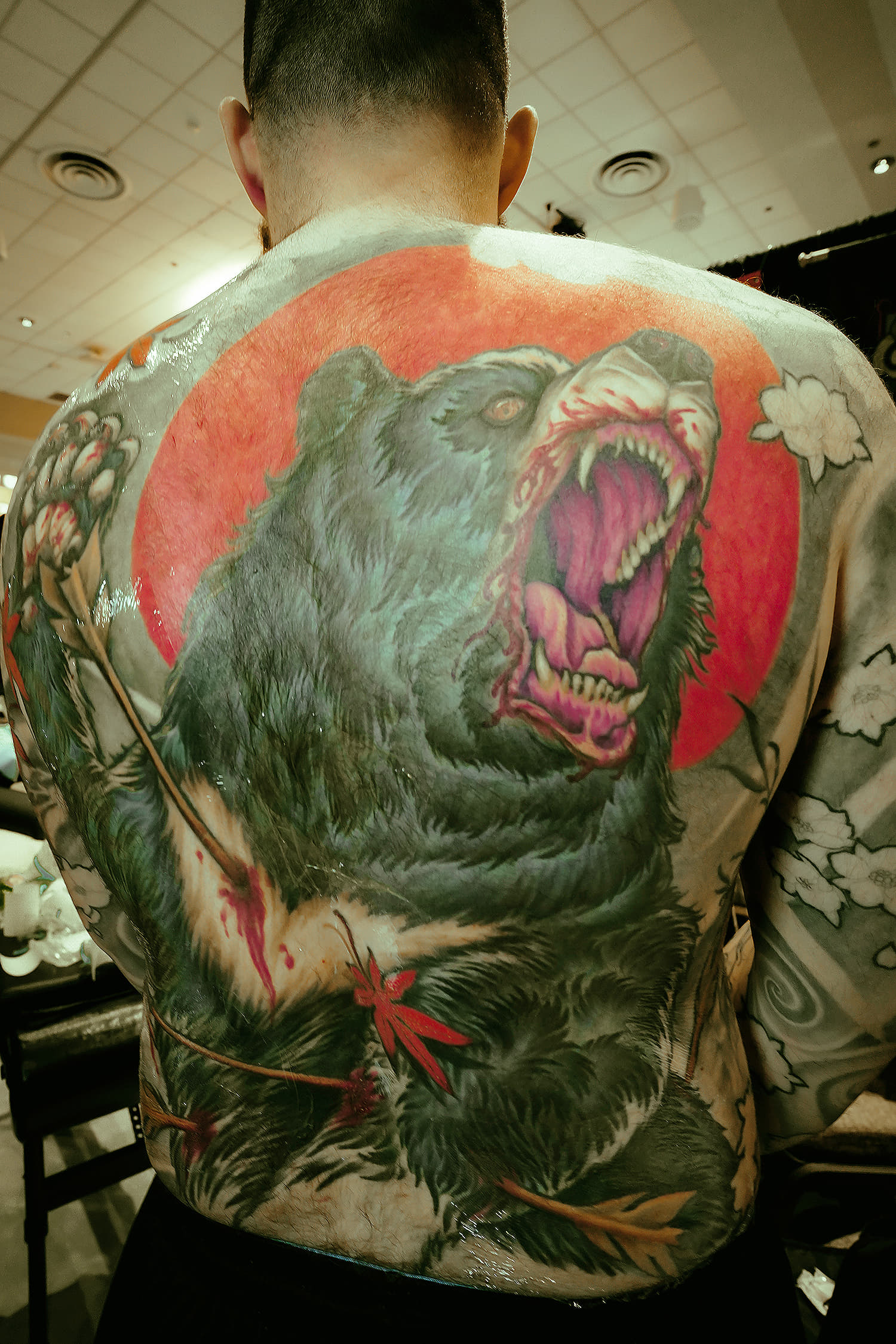 bear tattoo on back by brian Chambers from Reno photo copyright Adriana de Barros