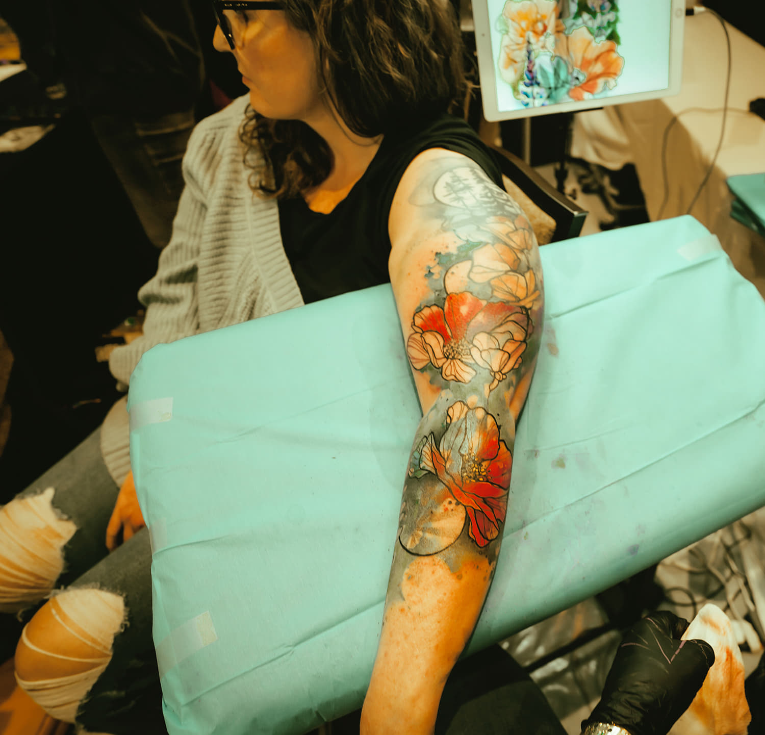 painterly flower tattoo on arm by justin nordine photo copyright Adriana de Barros