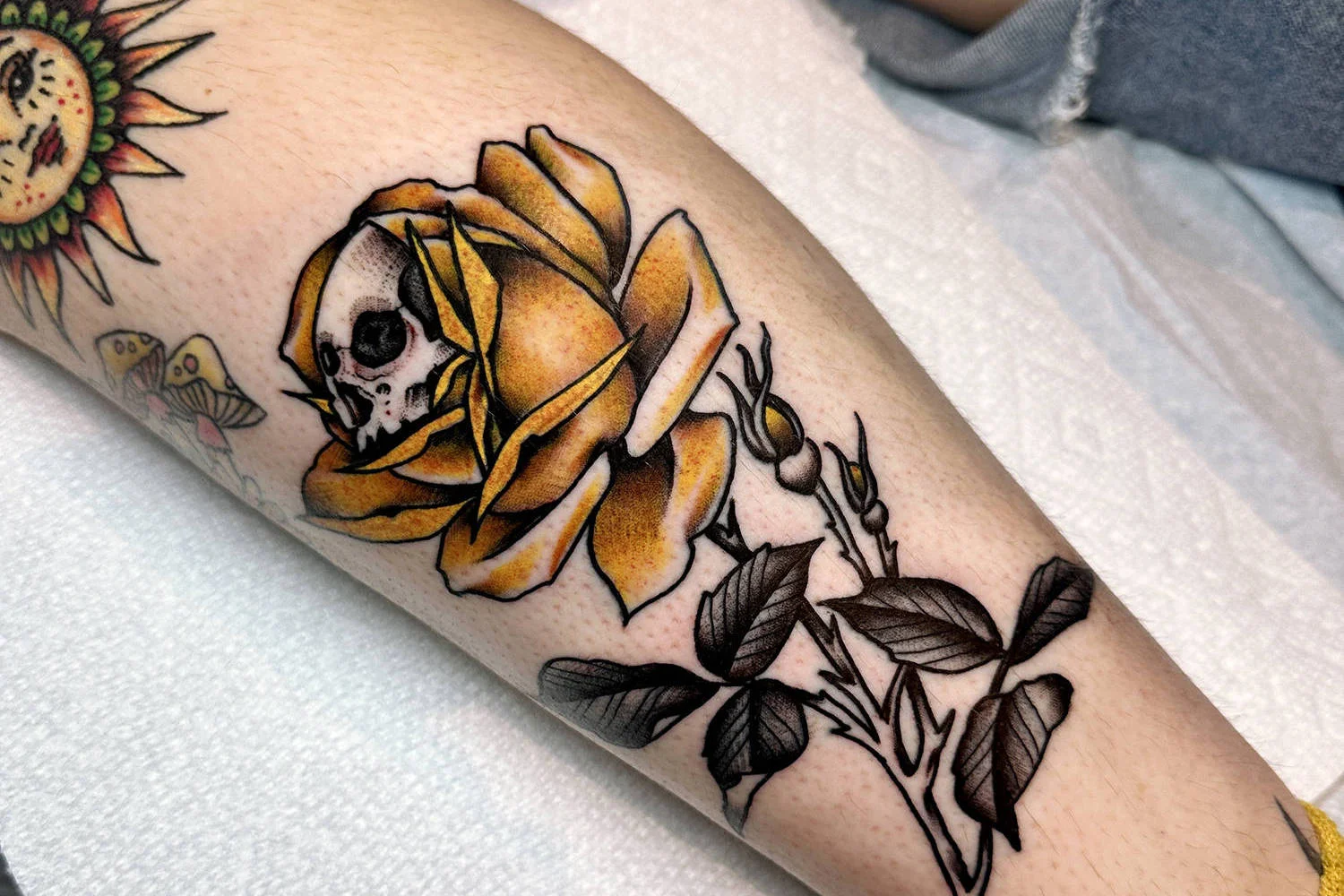 skull in rose tattoo