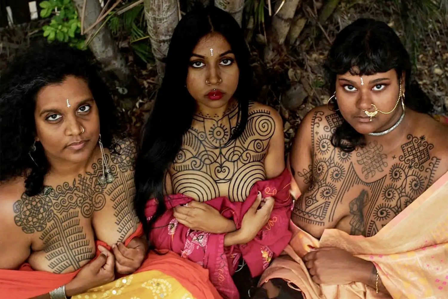 kolam tattoos on women's chests by gunga ma