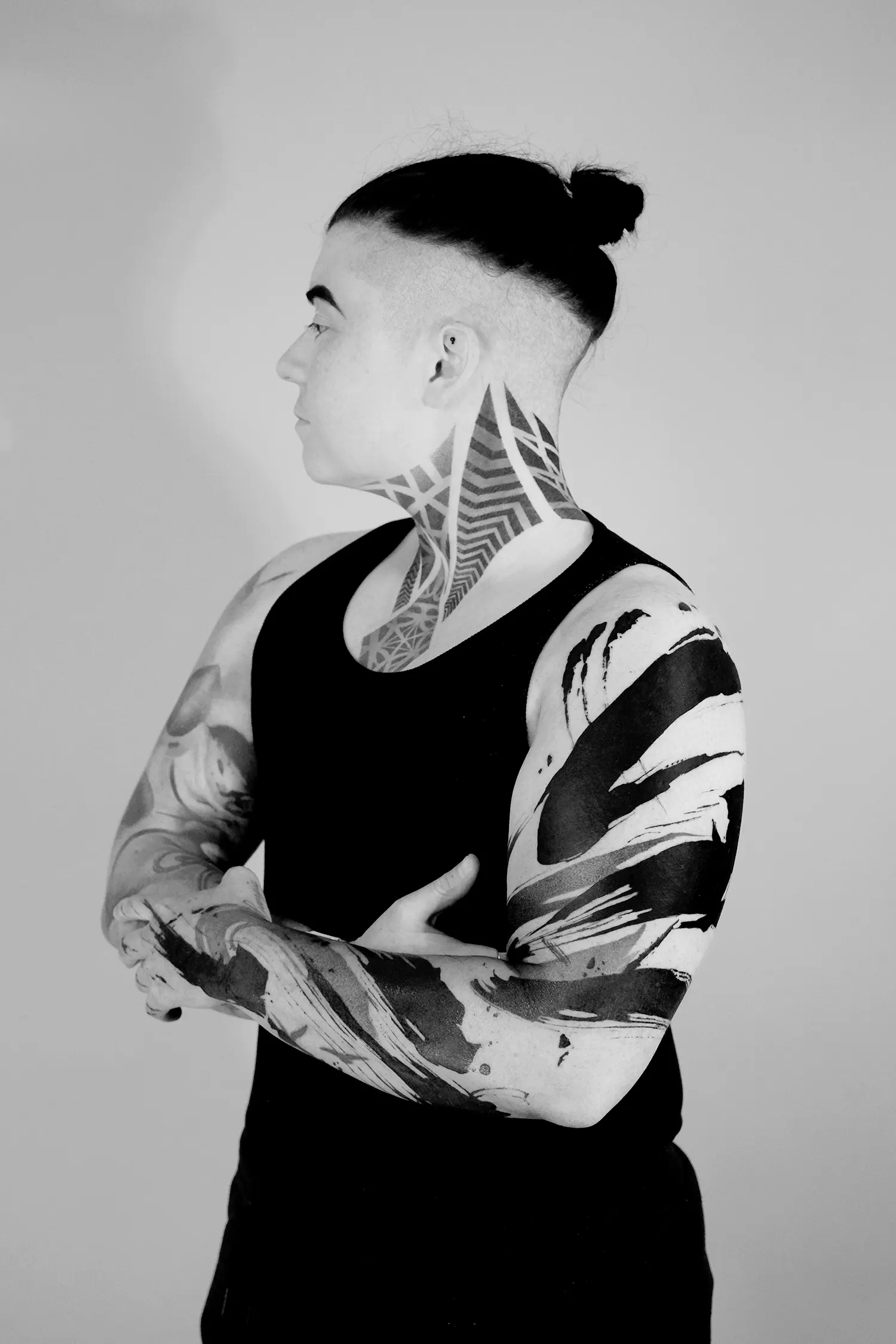 thick black ink brushstroke tattoo on arm